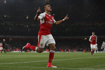 Arsenal's Chilean striker Alexis Sanchez celebrates scoring the second goal during the English Premier League football match between Arsenal and Sunderland at the Emirates Stadium in London on May 16, 2017.  / AFP PHOTO / Adrian DENNIS / RESTRICTED TO EDI