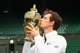 LONDON, ENGLAND - JULY 11:  Andy Murray of Great Britain revisits centre court as he kisses the trophy at Wimbledon on July 11, 2016 in London, England.  (Photo by Julian Finney/Getty Images)