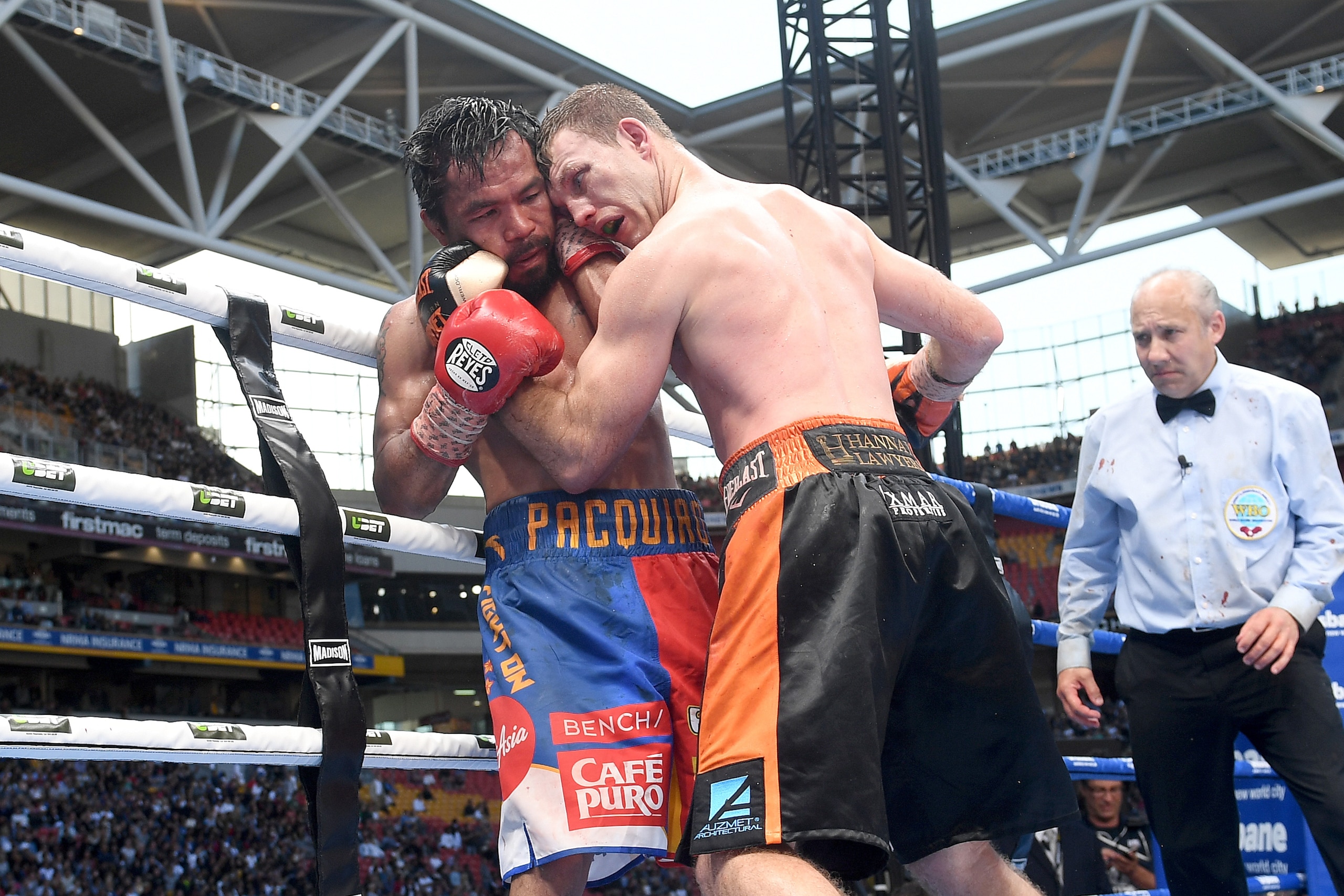 BRISBANE, QLD - JULY 02:  Jeff Horn of Australia and Manny Pacquiao grapple during the WBO Welterweight Title Fight between Jeff Horn of Australia and Manny Pacquiao of the Philippines at Suncorp Stadium on July 2, 2017 in Brisbane, Australia.  (Photo by 