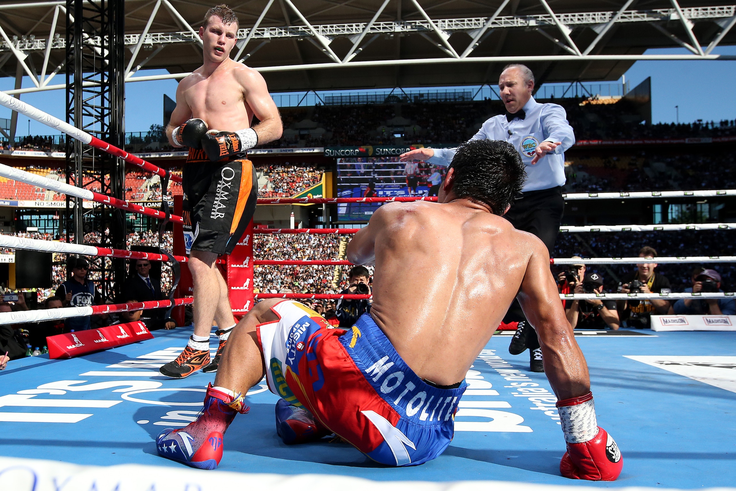 BRISBANE, QLD - JULY 02: Jeff Horn is seen looking over Manny Pacquiao after he slips over during the WBO Welterweight Title Fight between Jeff Horn of Australia and Manny Pacquiao of the Philippines at Suncorp Stadium on July 2, 2017 in Brisbane, Austral