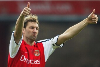 LONDON, UNITED KINGDOM:  Arsenal's Captain Tony Adams salutes the crowd during the game against Sunderland in the Premier League match at Highbury in London 30 March 2002. Adams playing his 500th league game, captained his team to a 3-0 victory. AFP PHOTO