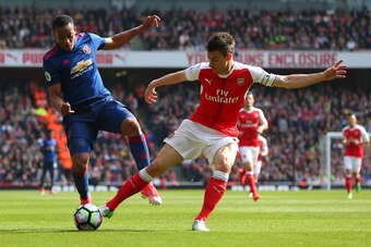 LONDON, ENGLAND - MAY 07: Anthony Martial of Manchester United and Laurent Koscielny of Arsenal during the Premier League match between Arsenal and Manchester United at Emirates Stadium on May 7, 2017 in London, England. (Photo by Catherine Ivill - AMA/Ge