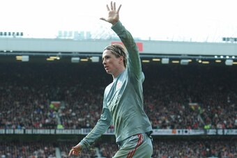Liverpool's Spanish forward Fernando Torres celebrates scoring the equalising goal against Manchester United during their English Premier League football match at Old Trafford in Manchester, north west England on March 14, 2009. AFP PHOTO/ANDREW YATES - F