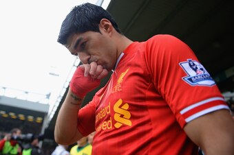 NORWICH, ENGLAND - APRIL 20:  Luis Suarez of Liverpool kisses his hand as he walks out during the Barclays Premier League match between Norwich City and Liverpool at Carrow Road on April 20, 2014 in Norwich, England.  (Photo by Michael Regan/Getty Images)