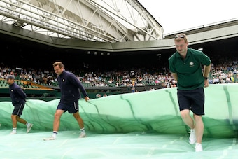 LONDON, ENGLAND - JULY 03: The rains covers are pulled across centre court during the Gentlemen's Singles first round match between Andy Murray of Great Britain and Alexander Bublik of Kazakhstan on day one of the Wimbledon Lawn Tennis Championships at t LONDON, ENGLAND - JULY 03: The rains covers are pulled across centre court during the Gentlemen's Singles first round match between Andy Murray of Great Britain and Alexander Bublik of Kazakhstan on day one of the Wimbledon Lawn Tennis Championships at t