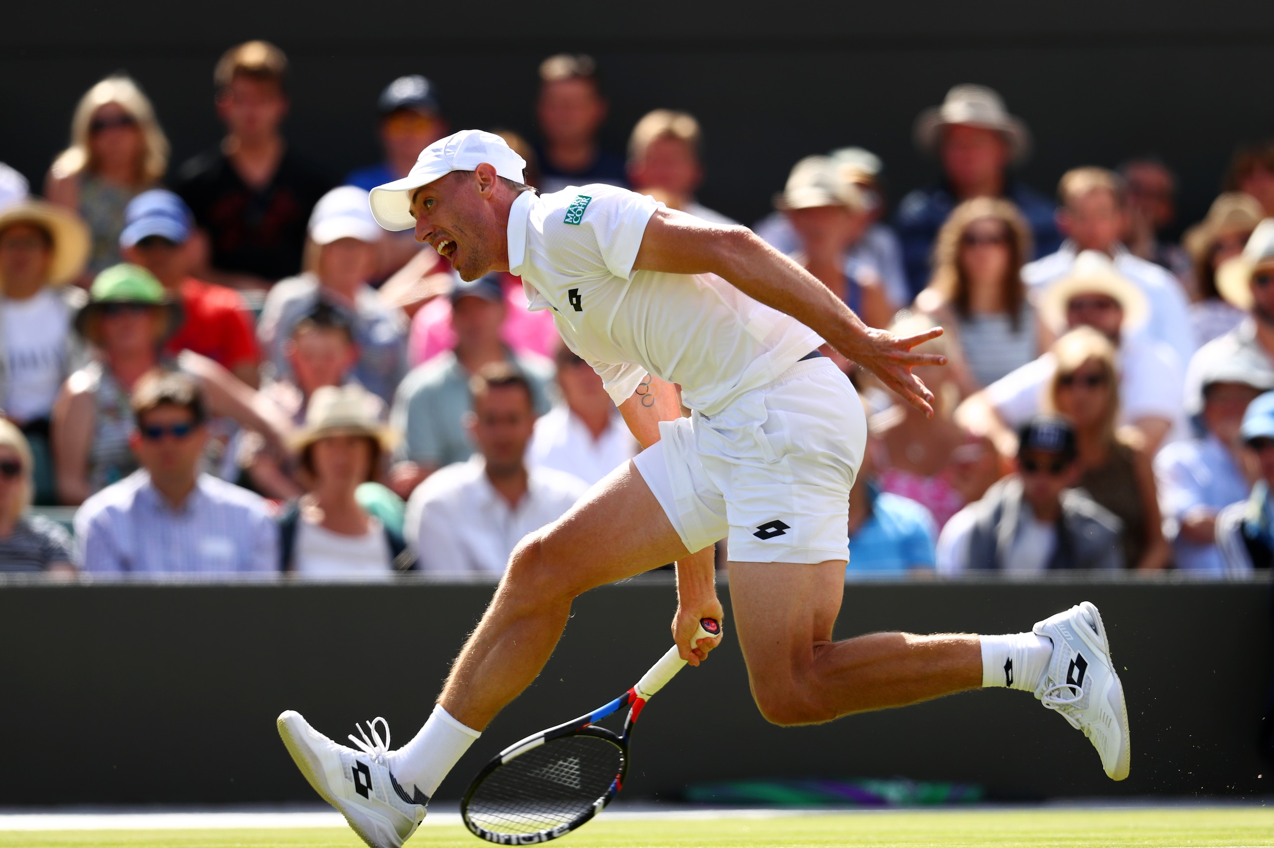 LONDON, ENGLAND - JULY 03:  John Millman of Australia in action during the Gentlemen's Singles first round match against Rafael Nadal of Spain on day one of the Wimbledon Lawn Tennis Championships at the All England Lawn Tennis and Croquet Club on July 3,