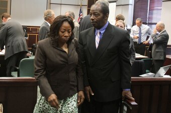 Ereck Plancher's parents, Gisele and Enock, leave the courtroom during the wrongful death trial of their son, who died in 2008 while a member of the University of Central Florida football team.