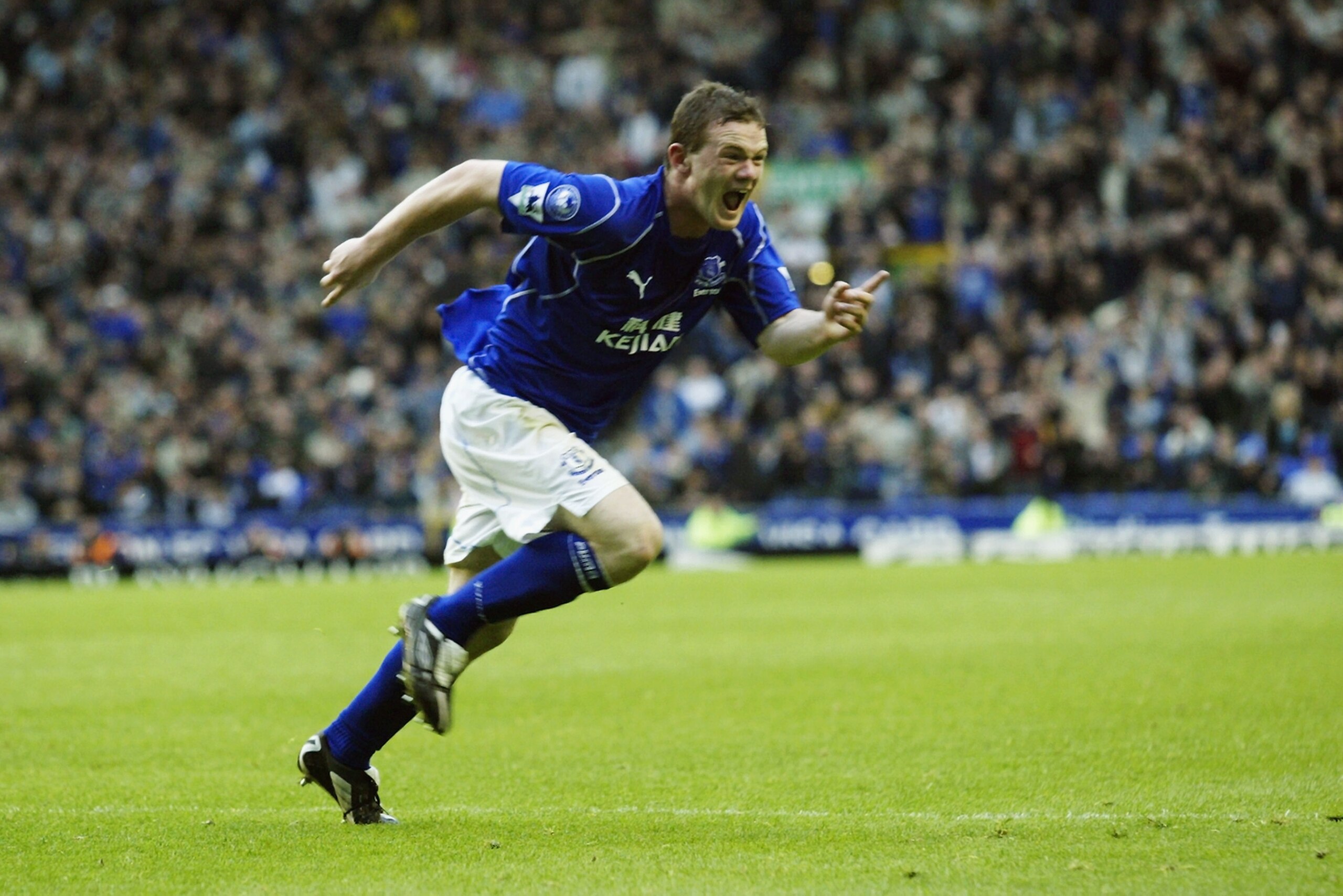 LIVERPOOL - APRIL 26:  Wayne Rooney of Everton celebrates scoring the winning goal during the FA Barclaycard Premiership match between Everton and Aston Villa held on April 26, 2003 at Goodison Park in Liverpool, England.  Everton won the match 2-1.  (Pho