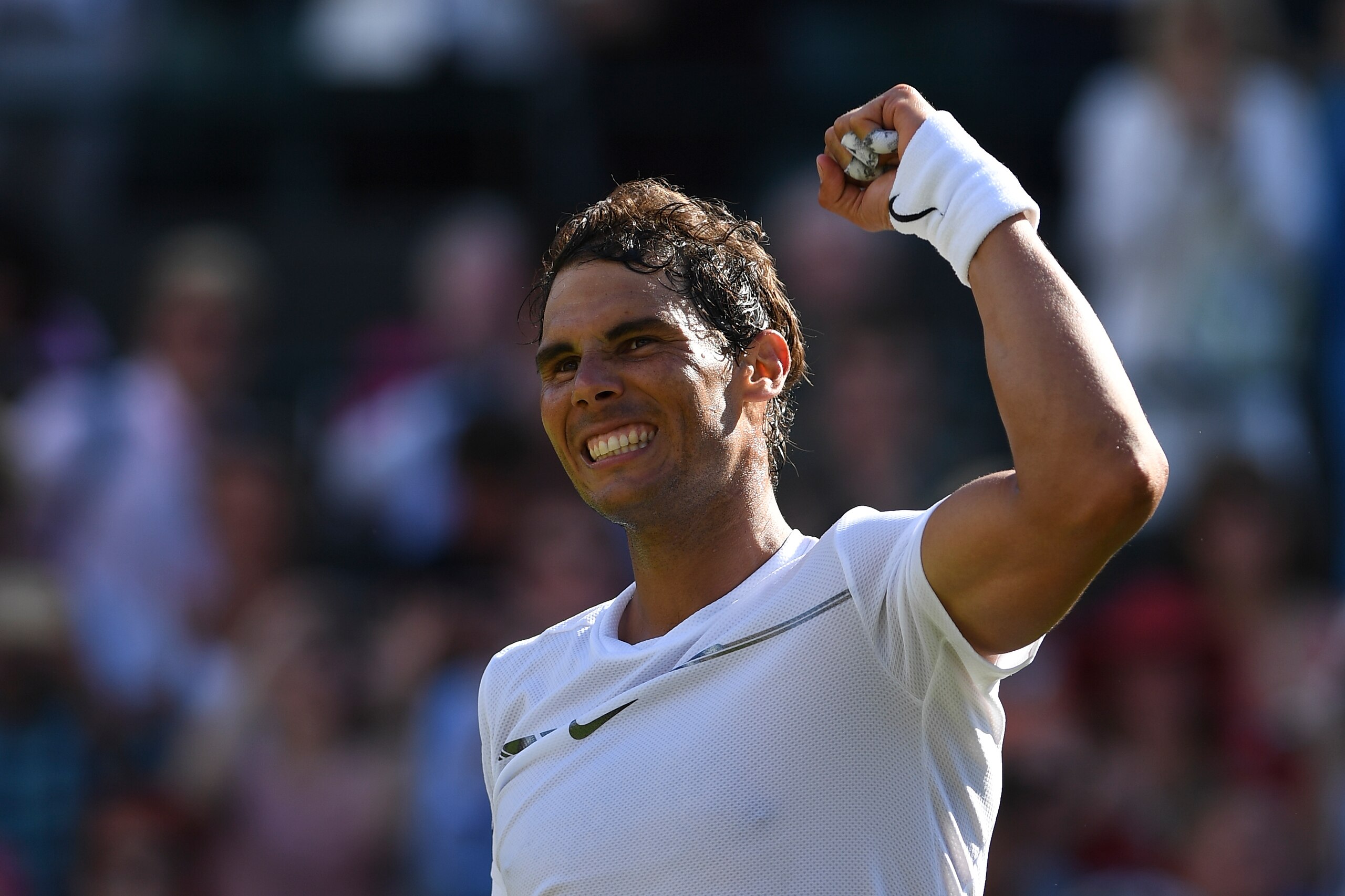 Spain's Rafael Nadal celebrates beating Australia's John Millman during their men's singles first round match on the first day of the 2017 Wimbledon Championships at The All England Lawn Tennis Club in Wimbledon, southwest London, on July 3, 2017. / AFP P