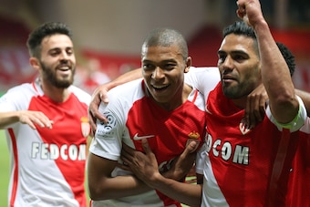 MONACO, MONACO - MAY 17: Kylian Mbappe of Monaco celebrates his goal between Bernardo Silva and Radamel Falcao during the French Ligue 1 match between AS Monaco and AS Saint-Etienne (ASSE) at Stade Louis II on May 17, 2017 in Monaco, Monaco. (Photo by Jea