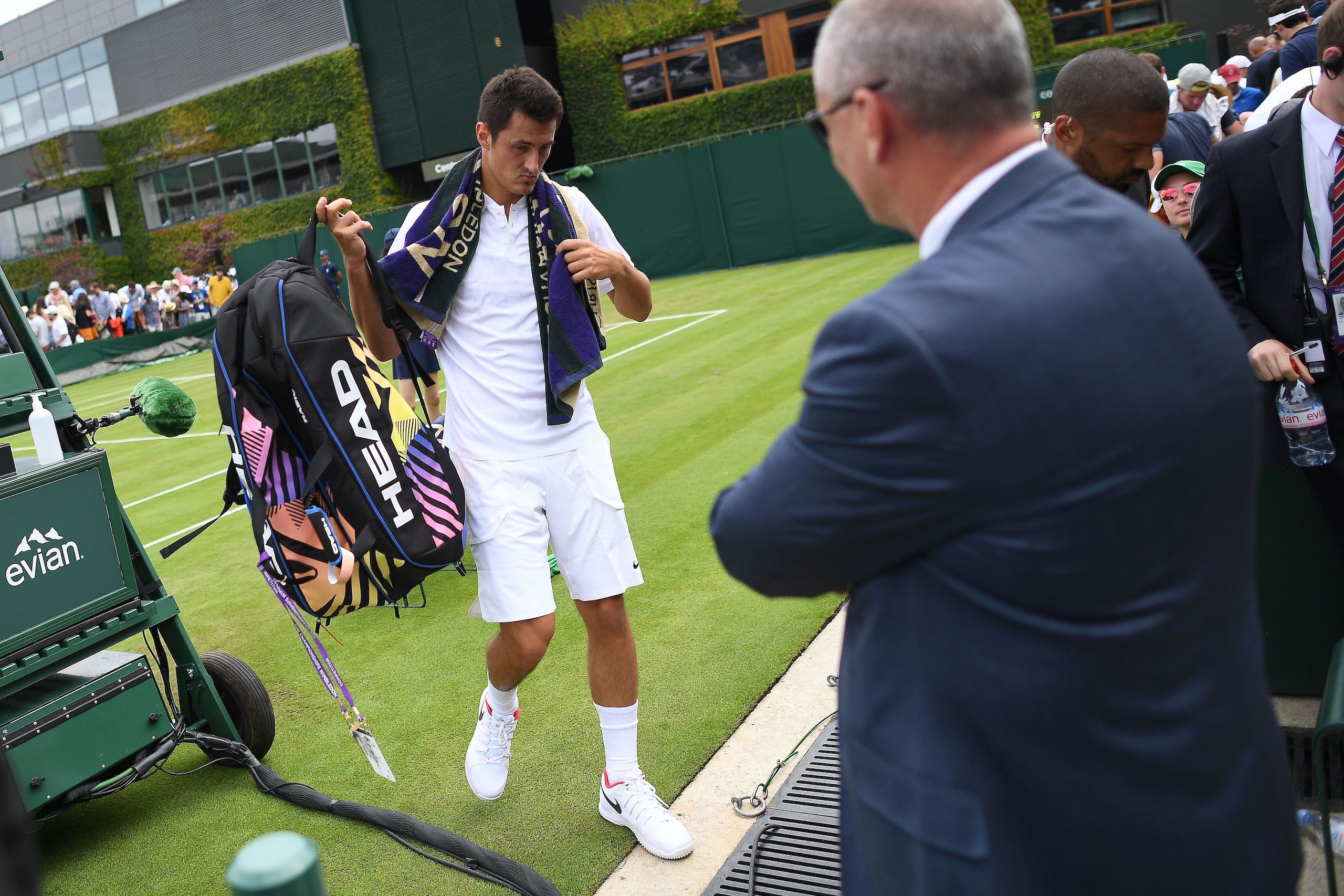 Australia's Bernard Tomic leaves the court after losing against Germany's Mischa Zverev during their men's singles first round match on the second day of the 2017 Wimbledon Championships at The All England Lawn Tennis Club in Wimbledon, southwest London, 