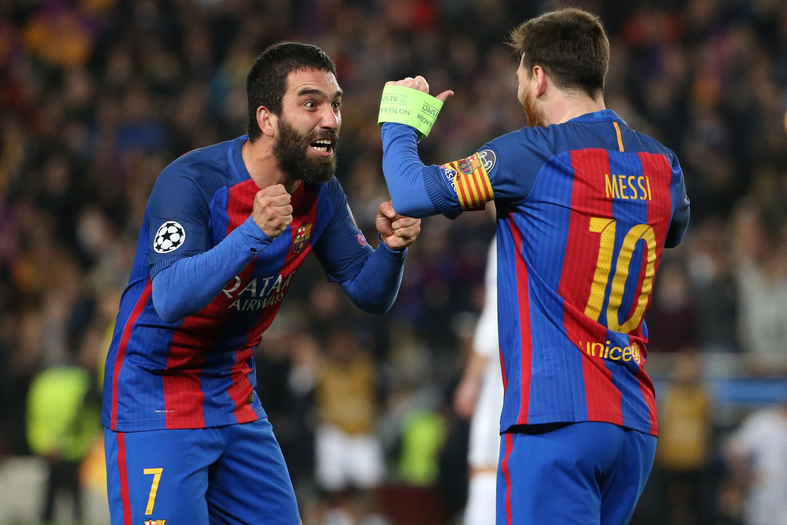 BARCELONA, SPAIN - MARCH 8: Arda Turan and Lionel Messi of FC Barcelona celebrate the victory following the UEFA Champions League Round of 16 second leg match between FC Barcelona and Paris Saint-Germain (PSG) at Camp Nou on March 8, 2017 in Barcelona, Sp