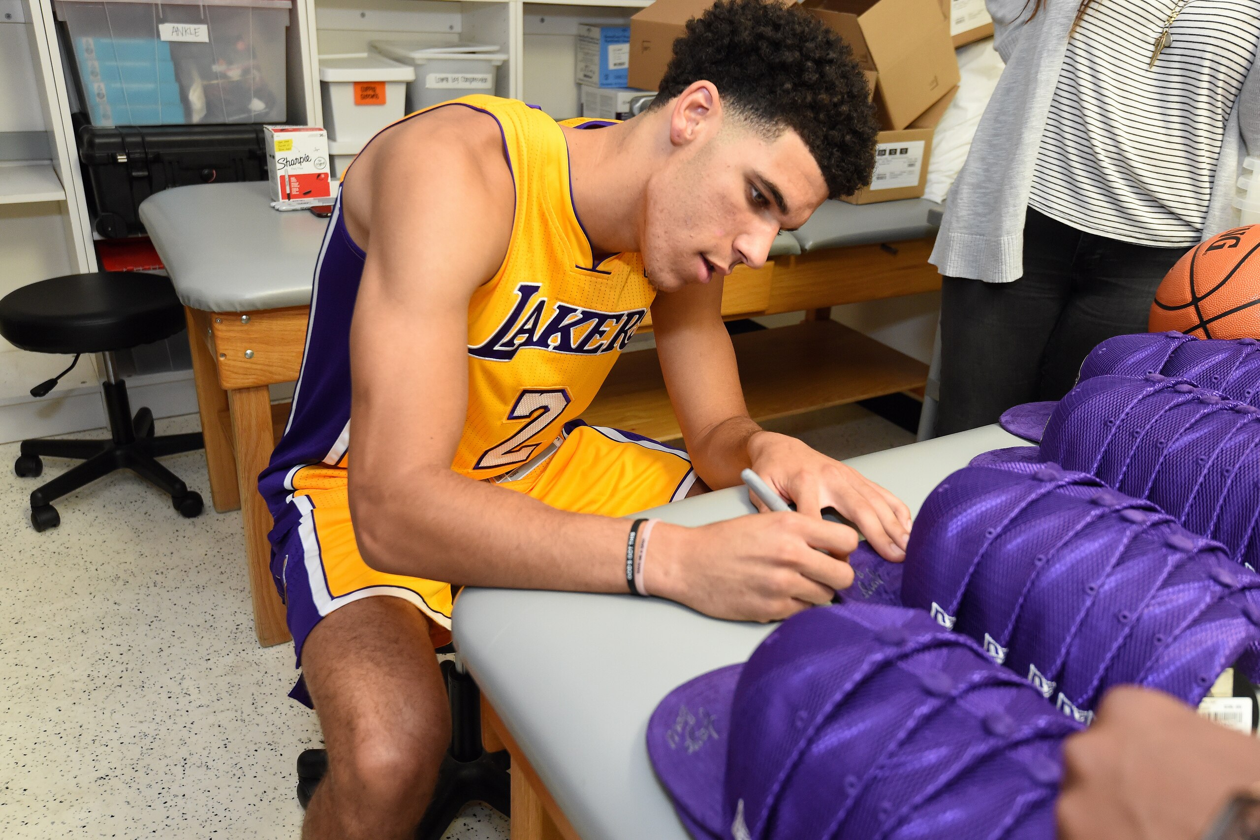 EL SEGUEDO, CA- JUNE 23: Lonzo Ball #2 of the Los Angeles Lakers signs autographs in the locker room following a press conference to introduce Los Angeles Lakers 2017 NBA Draft picks in El Segundo, California. NOTE TO USER: User expressly acknowledges an EL SEGUEDO, CA- JUNE 23: Lonzo Ball #2 of the Los Angeles Lakers signs autographs in the locker room following a press conference to introduce Los Angeles Lakers 2017 NBA Draft picks in El Segundo, California. NOTE TO USER: User expressly acknowledges an