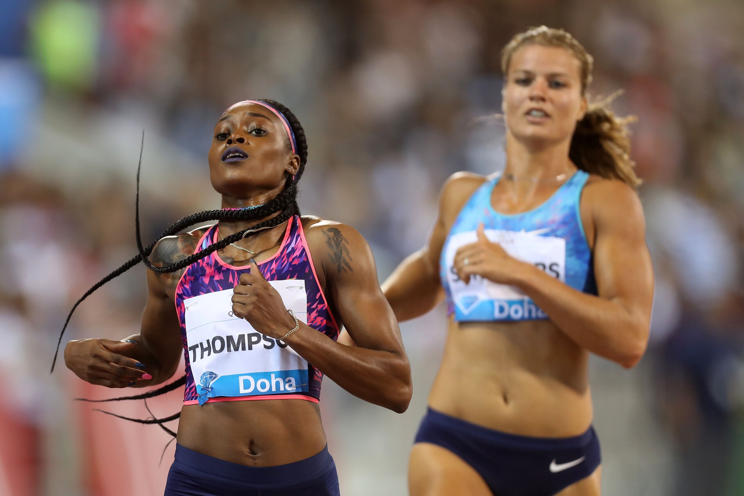 Jamaica's Elaine Thompson and Netherlands' Dafne Schippers compete in the women's 200 metres during the Diamond League athletics competition at the Suhaim bin Hamad Stadium in Doha, on May 5, 2017. / AFP PHOTO / KARIM JAAFAR        (Photo credit should re