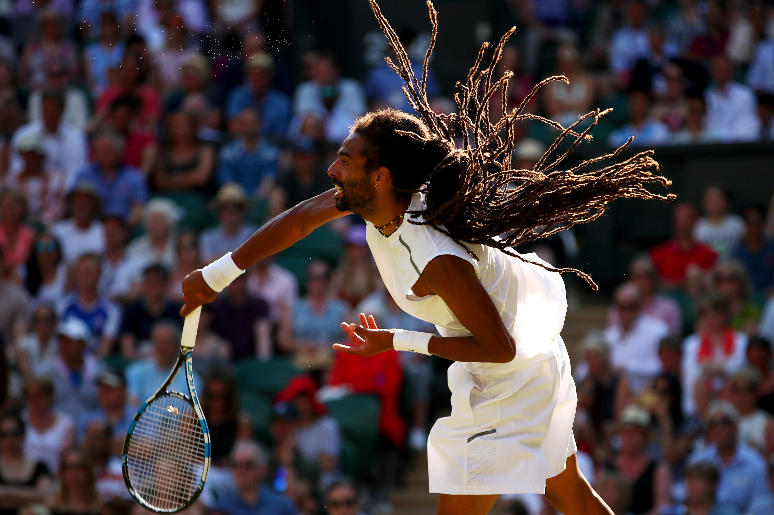 LONDON, ENGLAND - JULY 05:  Dustin Brown of Germany serves during the Gentlemen's Singles second round match against Andy Murray of Great Britain on day three of the Wimbledon Lawn Tennis Championships at the All England Lawn Tennis and Croquet Club on Ju