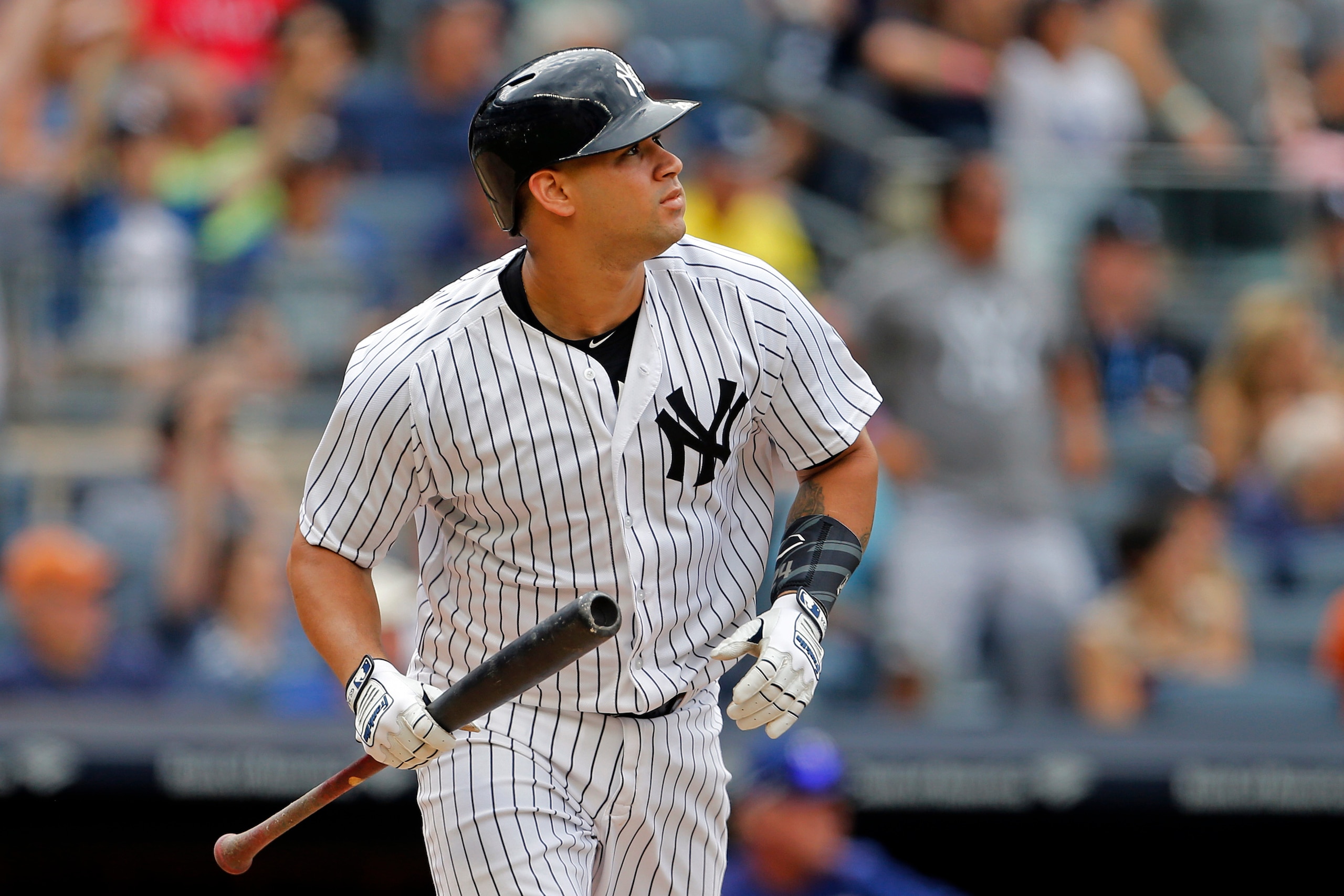 NEW YORK, NY - JUNE 25: Gary Sanchez #24 of the New York Yankees watches a two-run home run against the Texas Rangers during the fifth inning at Yankee Stadium on June 25, 2017 in the Bronx borough of New York City. (Photo by Adam Hunger/Getty Images)