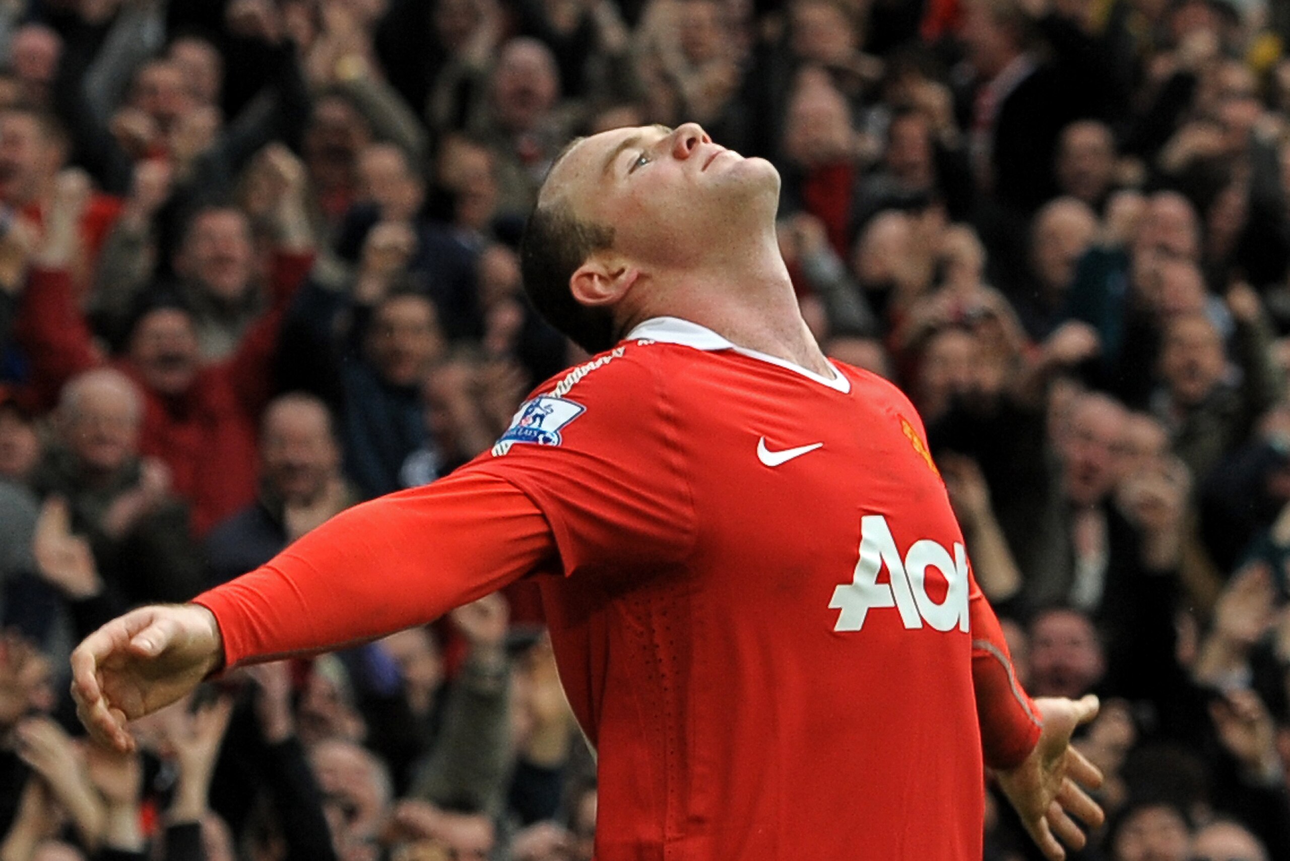 Manchester United's English striker Wayne Rooney celebrates scoring the winning goal of the English Premier League football match between Manchester United and Manchester City at Old Trafford in Manchester, north-west England on February 12, 2011. Manches