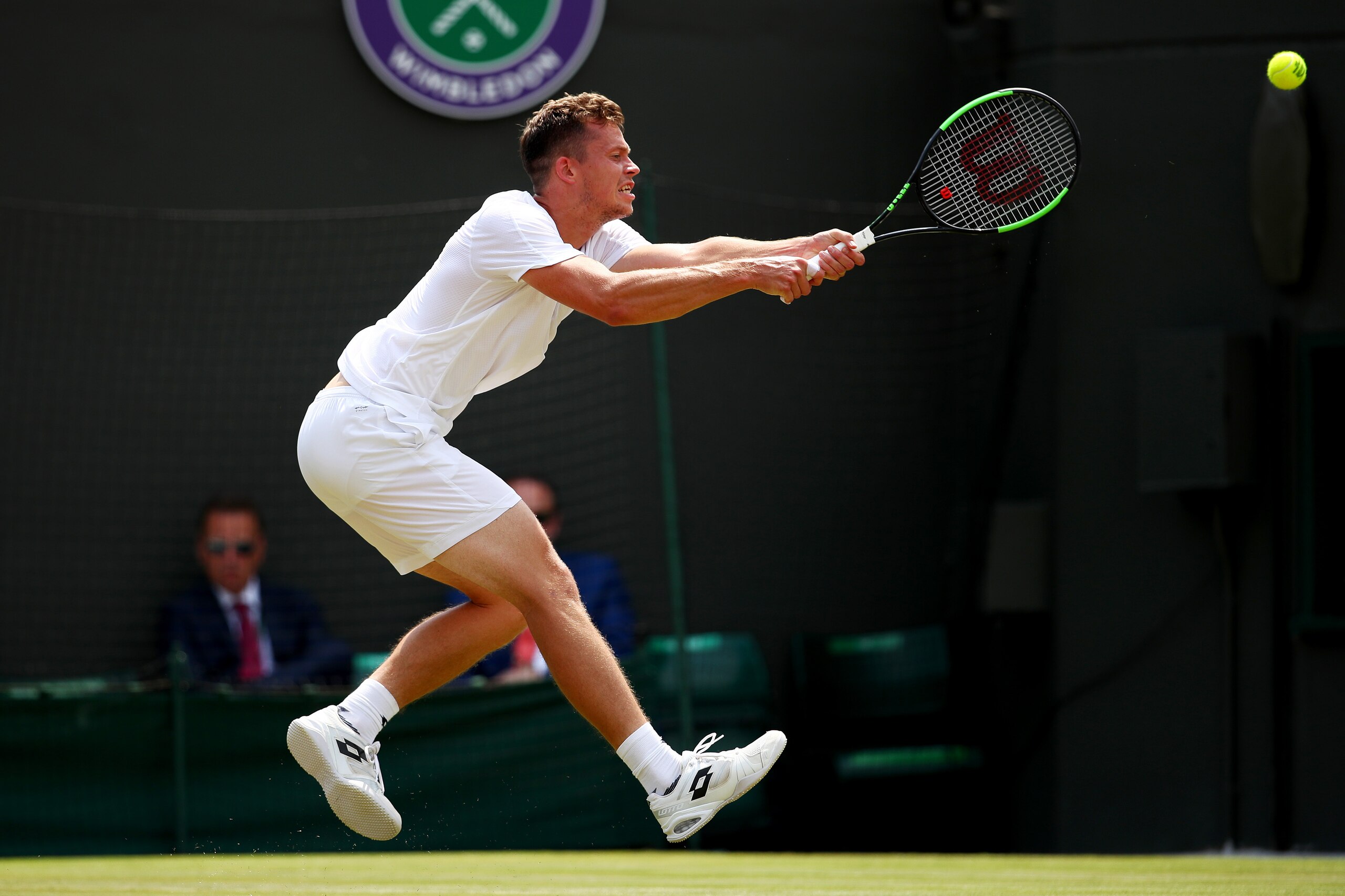 LONDON, ENGLAND - JULY 06:  Adam Pavlasek of the Czech Republic plays a backhand during the Gentlemen's Singles secon round match against Novak Djokovic of Serbia on day four of the Wimbledon Lawn Tennis Championships at the All England Lawn Tennis and Cr