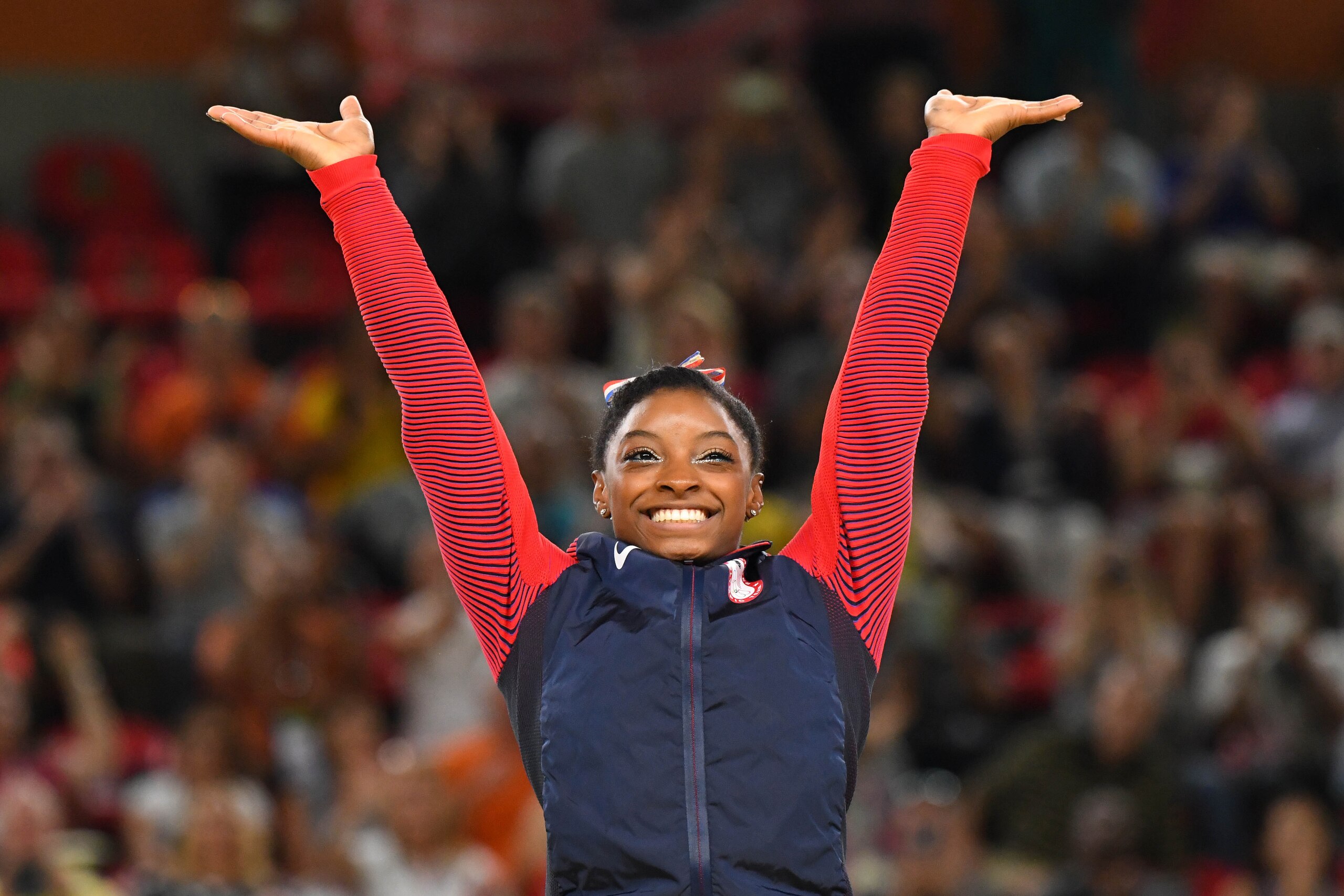 Aug 16, 2016; Rio de Janeiro, Brazil: Simone Biles (USA) celebrates after winning a gold medal during to the women's floor exercise final in the Rio 2016 Summer Olympic Games at Rio Olympic Arena. Mandatory Credit: Robert Deutsch-USA TODAY Sports
