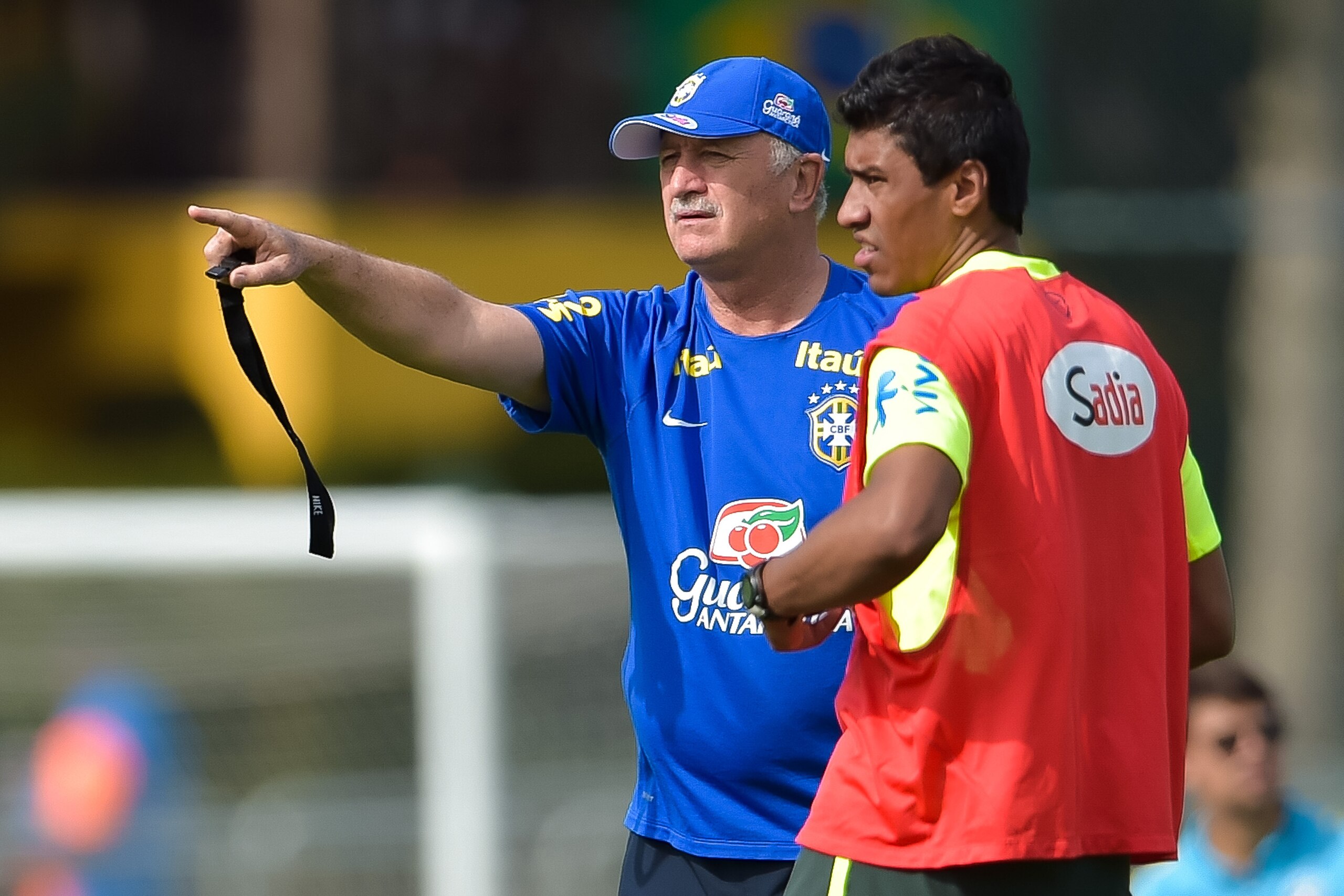 TERESOPOLIS, BRAZIL - JUNE 26: Head coach Luiz Felipe Scolari gives instructions for Paulinho during a training session of the Brazilian national football team at the squad's Granja Comary training complex, on June 26, 2014 in Teresopolis, 90 km from down