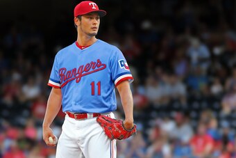 Yu Darvish in a redesigned Rangers uniform that plays with brighter shades of red, white and blue.