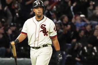 Jose Abreu in a redesigned White Sox uniform with hints of red and cream.