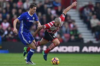 Chelsea's Serbian midfielder Nemanja Matic (L) fouls Southampton's Sepanish midfielder Oriol Romeu (R) during the English Premier League football match between Southampton and Chelsea at St Mary's Stadium in Southampton, southern England on October 30, 20