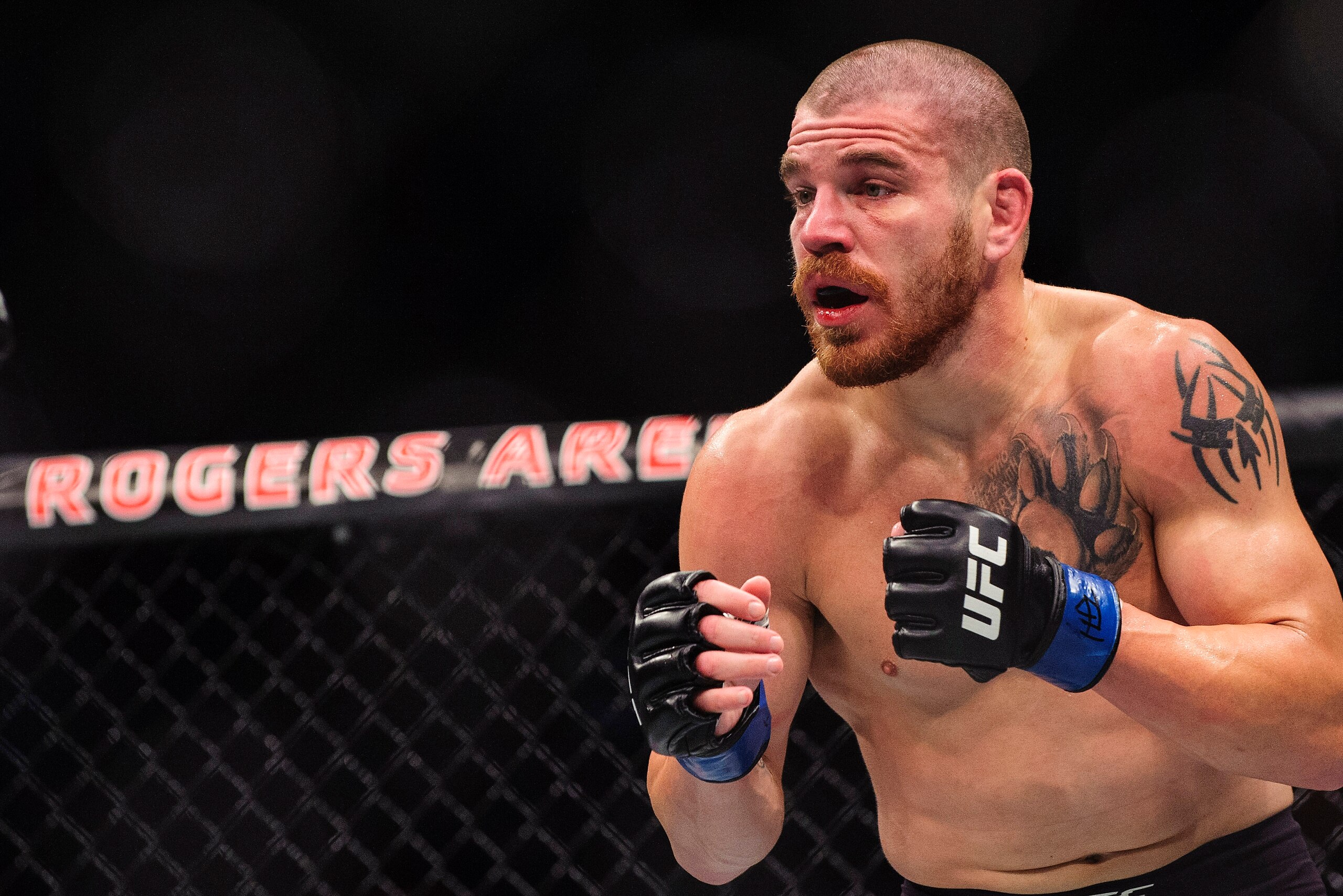 Aug 27, 2016; Vancouver, BC, Canada; Jim Miller (blue gloves) fights Joe Lauzon (red gloves) during UFC Fight Night at Rogers Arena. Mandatory Credit: Anne-Marie Sorvin-USA TODAY Sports
