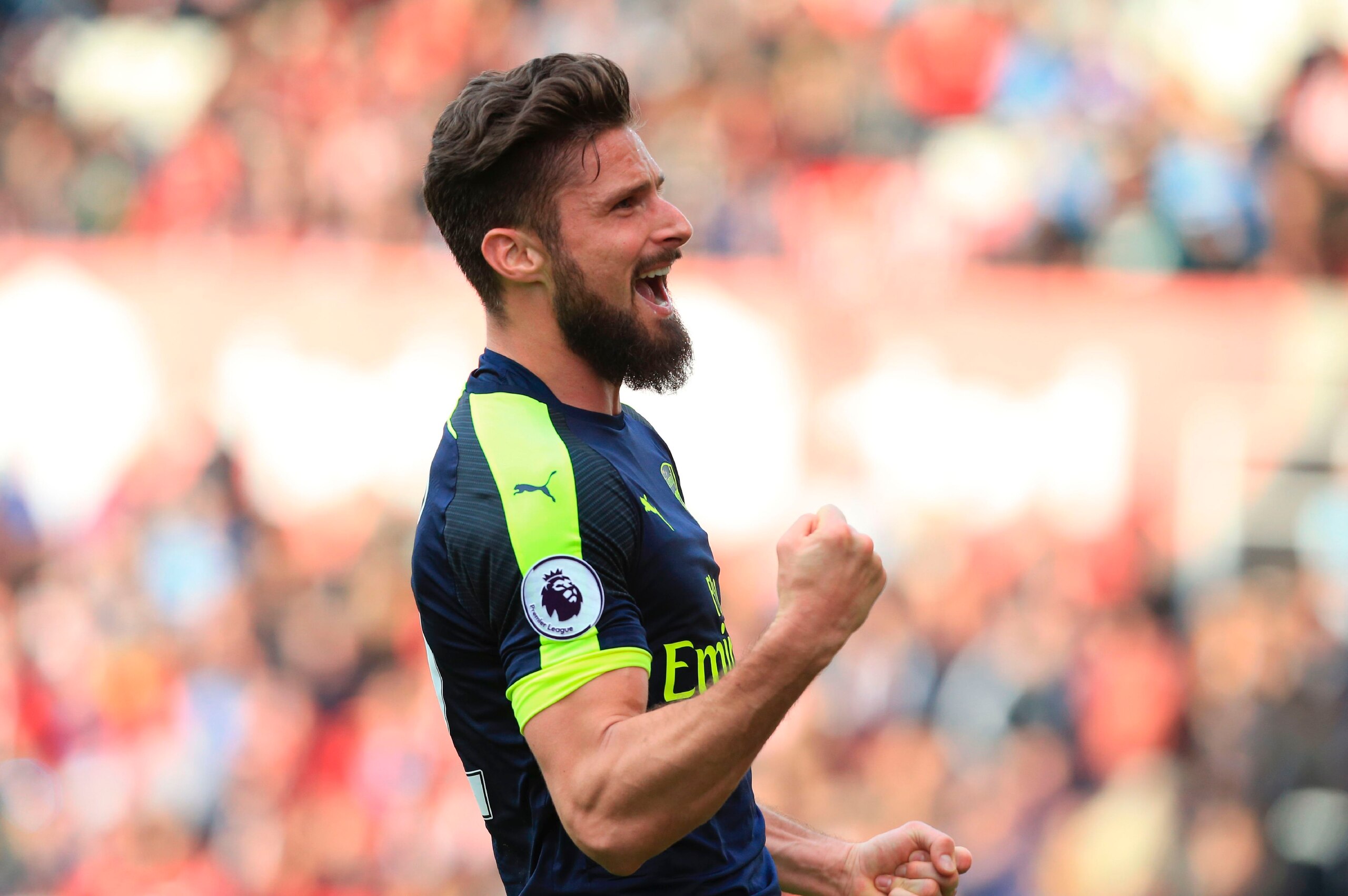 Arsenal's French striker Olivier Giroud celebrates after scoring their fourth goal during the English Premier League football match between Stoke City and Arsenal at the Bet365 Stadium in Stoke-on-Trent, central England on May 13, 2017.
Arsenal won the ga
