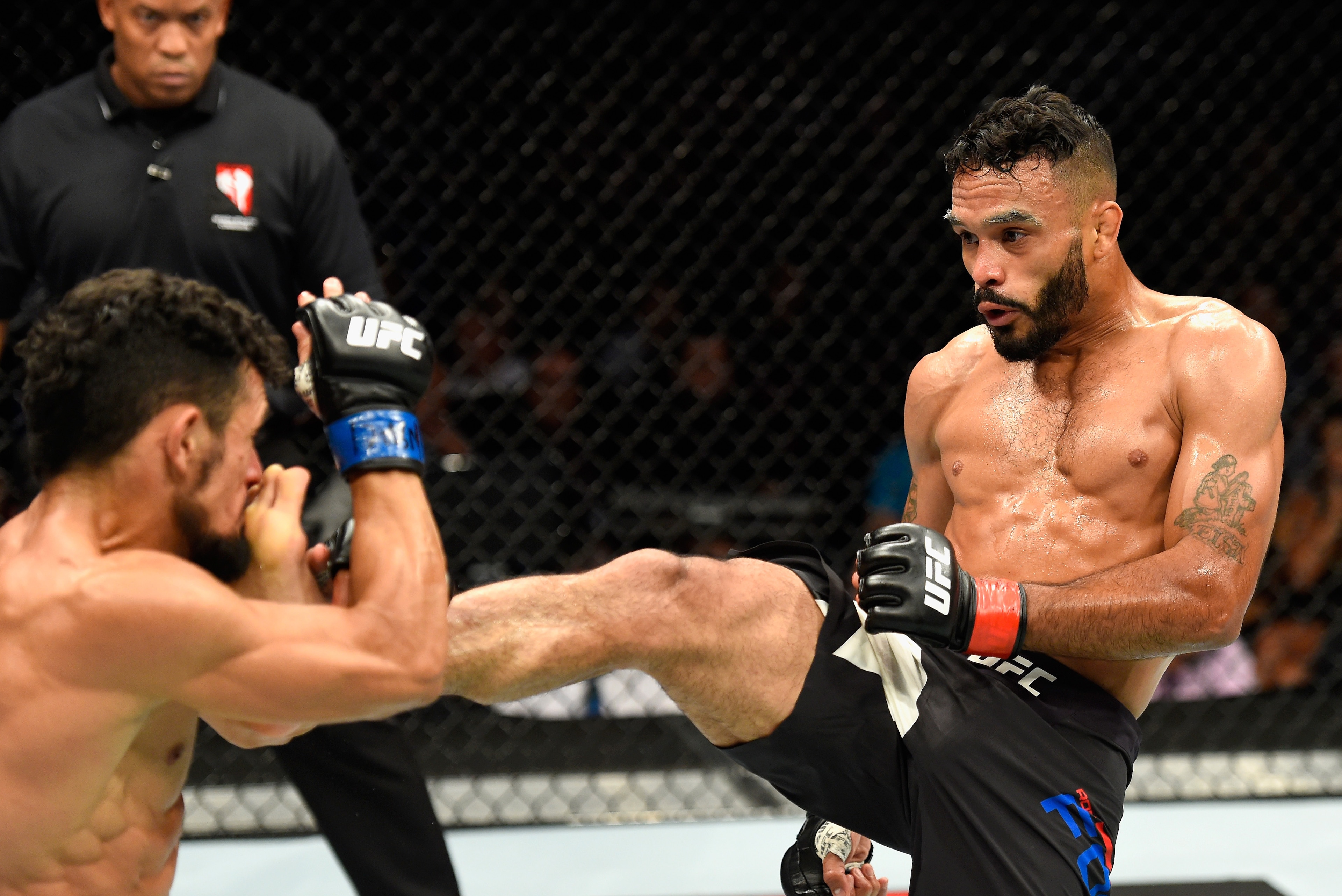 LAS VEGAS, NV - JULY 08: (R-L) Rob Font kicks Douglas Silva de Andrade of Brazil in their bantamweight bout during the UFC 213 event at T-Mobile Arena on July 8, 2017 in Las Vegas, Nevada. (Photo by Josh Hedges/Zuffa LLC/Zuffa LLC via Getty Images) LAS VEGAS, NV - JULY 08: (R-L) Rob Font kicks Douglas Silva de Andrade of Brazil in their bantamweight bout during the UFC 213 event at T-Mobile Arena on July 8, 2017 in Las Vegas, Nevada. (Photo by Josh Hedges/Zuffa LLC/Zuffa LLC via Getty Images)