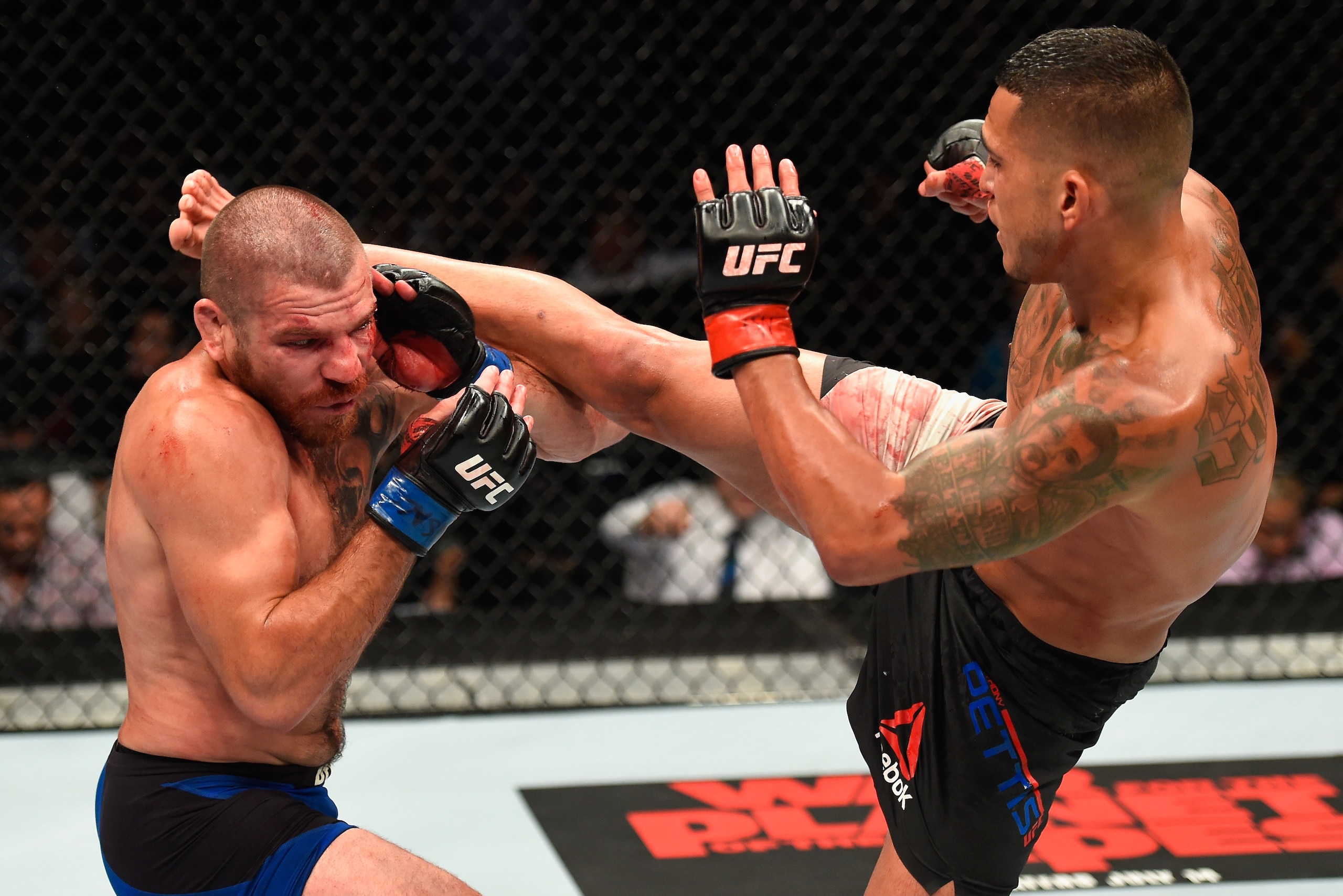 LAS VEGAS, NV - JULY 08:  (R-L) Anthony Pettis kicks Jim Miller in their lightweight bout during the UFC 213 event at T-Mobile Arena on July 8, 2017 in Las Vegas, Nevada.  (Photo by Josh Hedges/Zuffa LLC/Zuffa LLC via Getty Images)