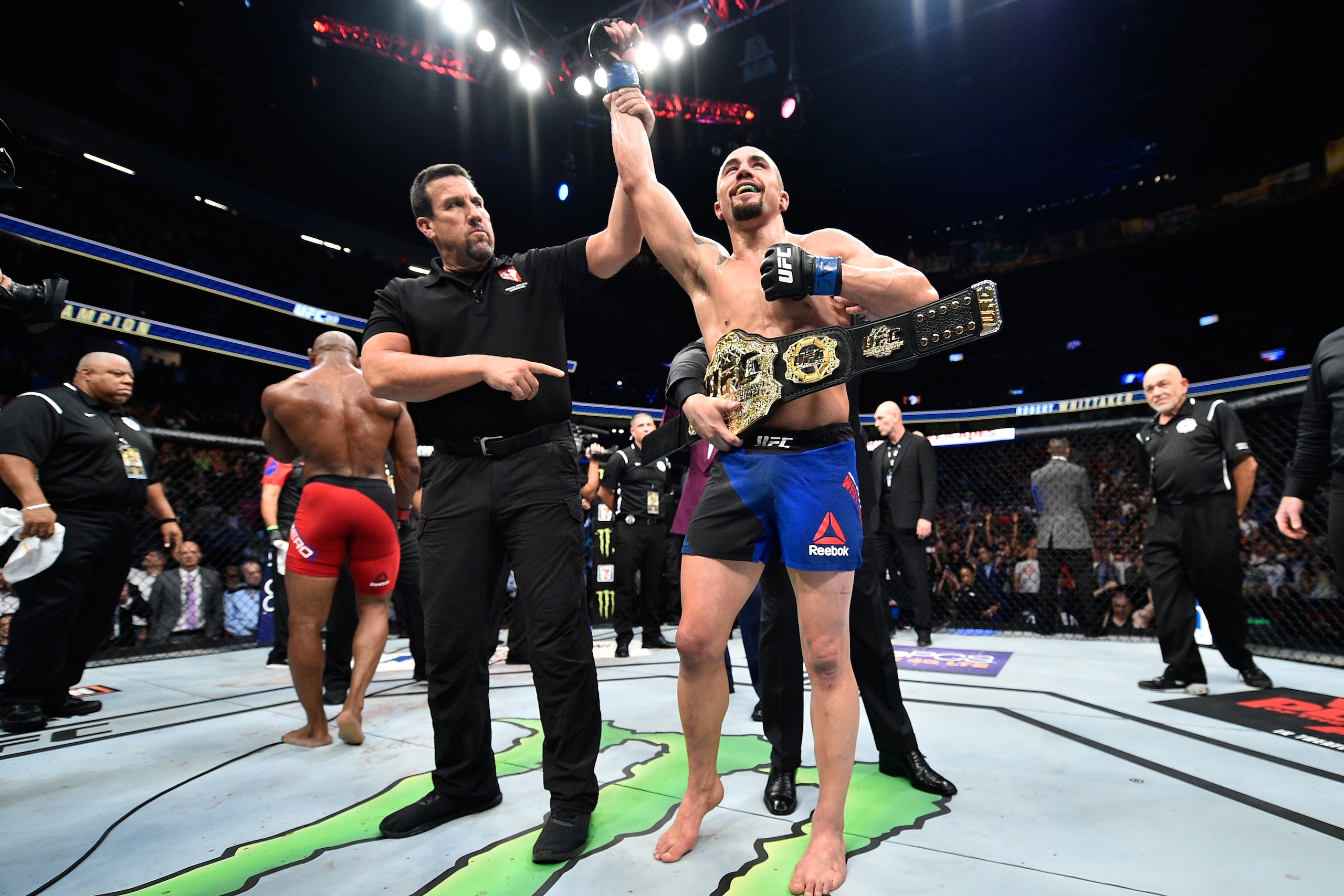 LAS VEGAS, NV - JULY 08:  (R-L) Robert Whittaker of New Zealand celebrates his victory over Yoel Romero of Cuba in their interim UFC middleweight championship bout during the UFC 213 event at T-Mobile Arena on July 8, 2017 in Las Vegas, Nevada.  (Photo by