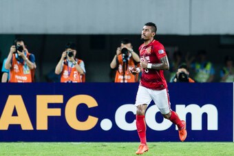 GUANGZHOU, CHINA - MAY 23: Guangzhou Midfielder Paulinho Maciel celebrating his score during the AFC Champions League 2017 Round of 16 match between Guangzhou Evergrande FC (CHN) vs Kashima Antlers (JPN) at the Tianhe Stadium on 23 May 2017 in Guangzhou, 