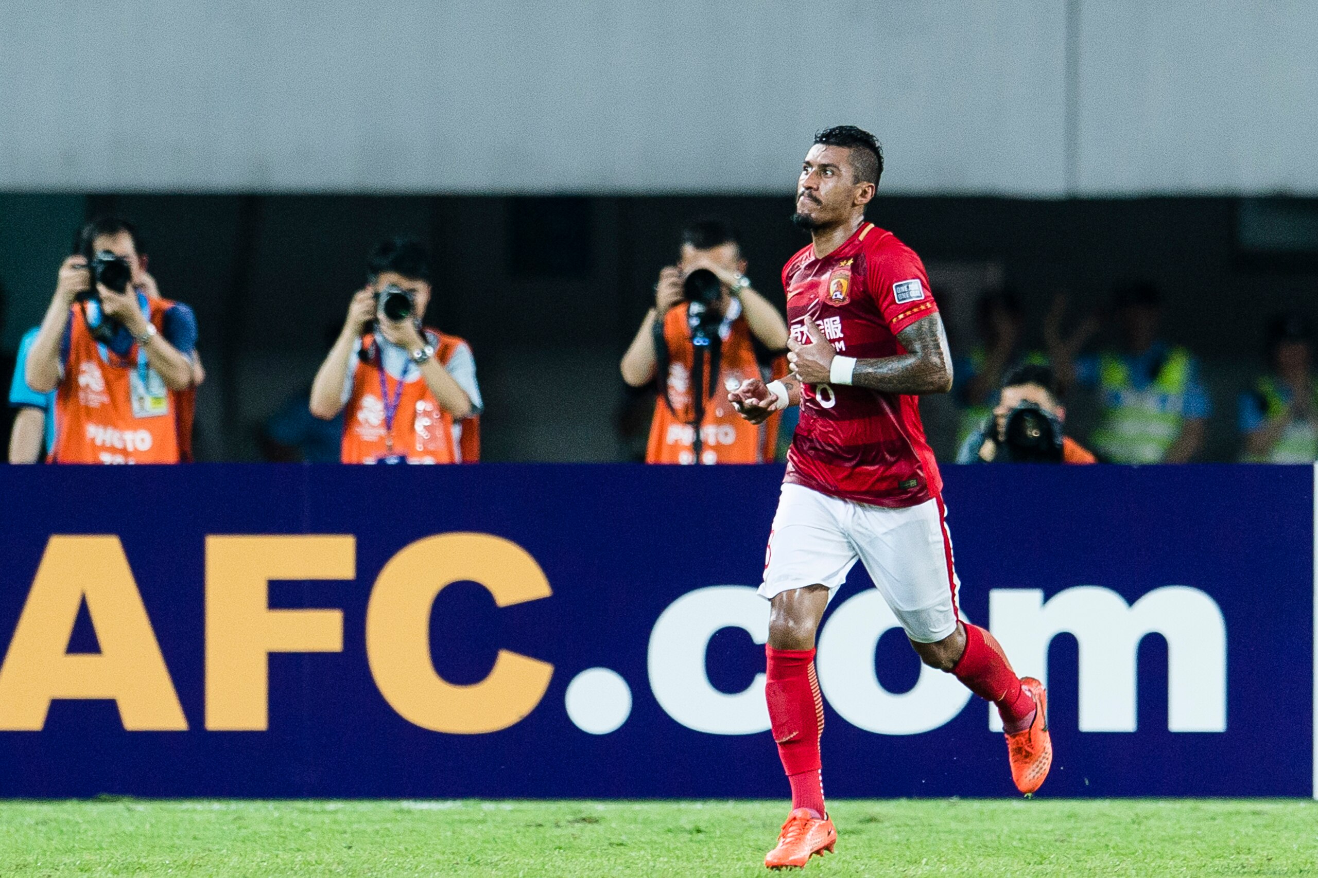 GUANGZHOU, CHINA - MAY 23: Guangzhou Midfielder Paulinho Maciel celebrating his score during the AFC Champions League 2017 Round of 16 match between Guangzhou Evergrande FC (CHN) vs Kashima Antlers (JPN) at the Tianhe Stadium on 23 May 2017 in Guangzhou, 