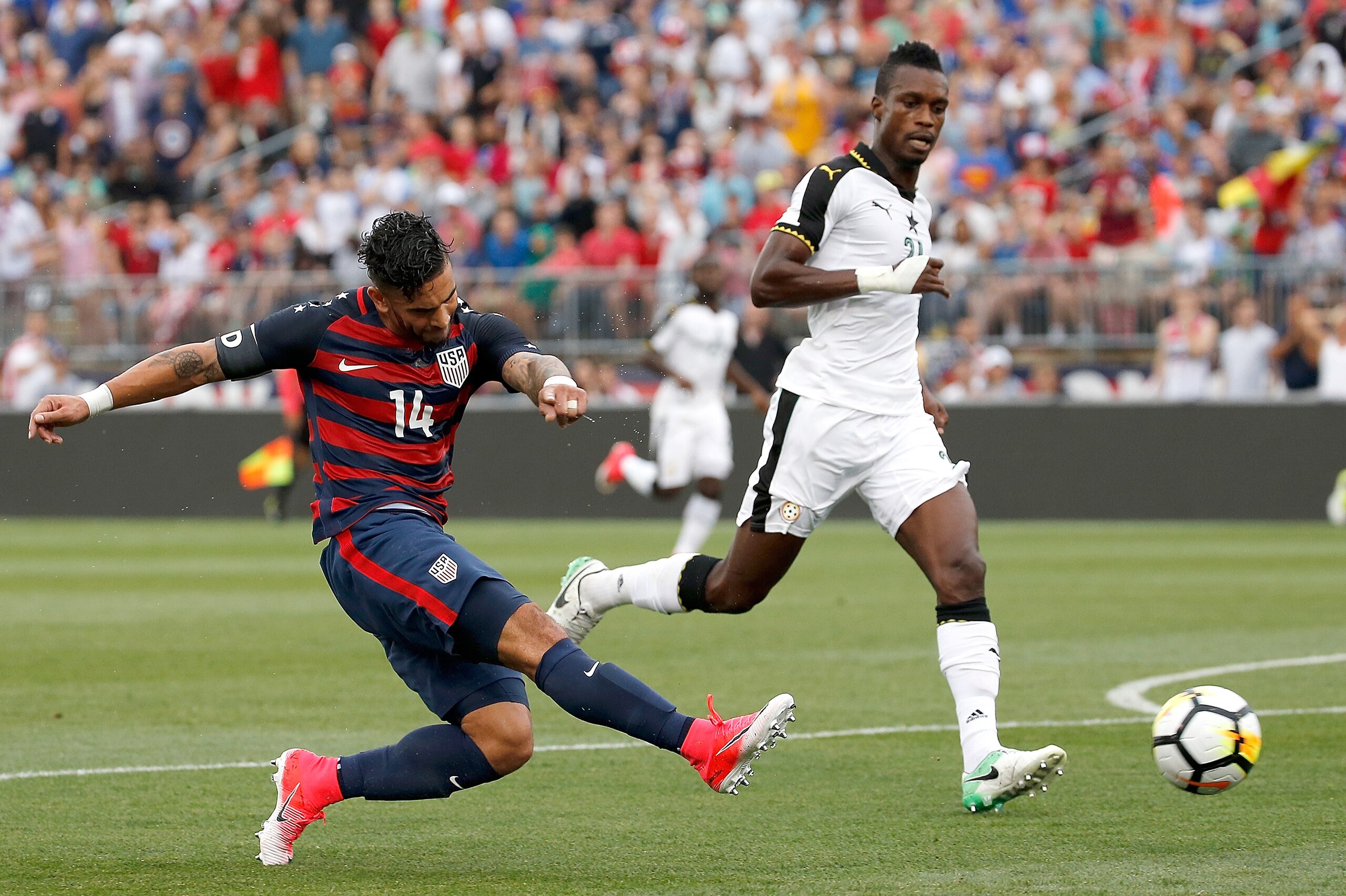 EAST HARTFORD, CT - JULY 01: Dom Dwyer #14 of the United States shoots by  defender John Boye #21 of Ghana in the first half during an international friendly between USA and Ghana at Pratt & Whitney Stadium on July 1, 2017 in East Hartford, Connecticut. (