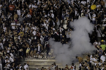 RIO DE JANEIRO, BRAZIL - JULY 08: Vasco fans get angry arter defeat in the game and come into confrontation with the police after the match between Vasco da Gama and Flamengo as part of Brasileirao Series A 2017 at Sao Januario Stadium on July 08, 2017 in