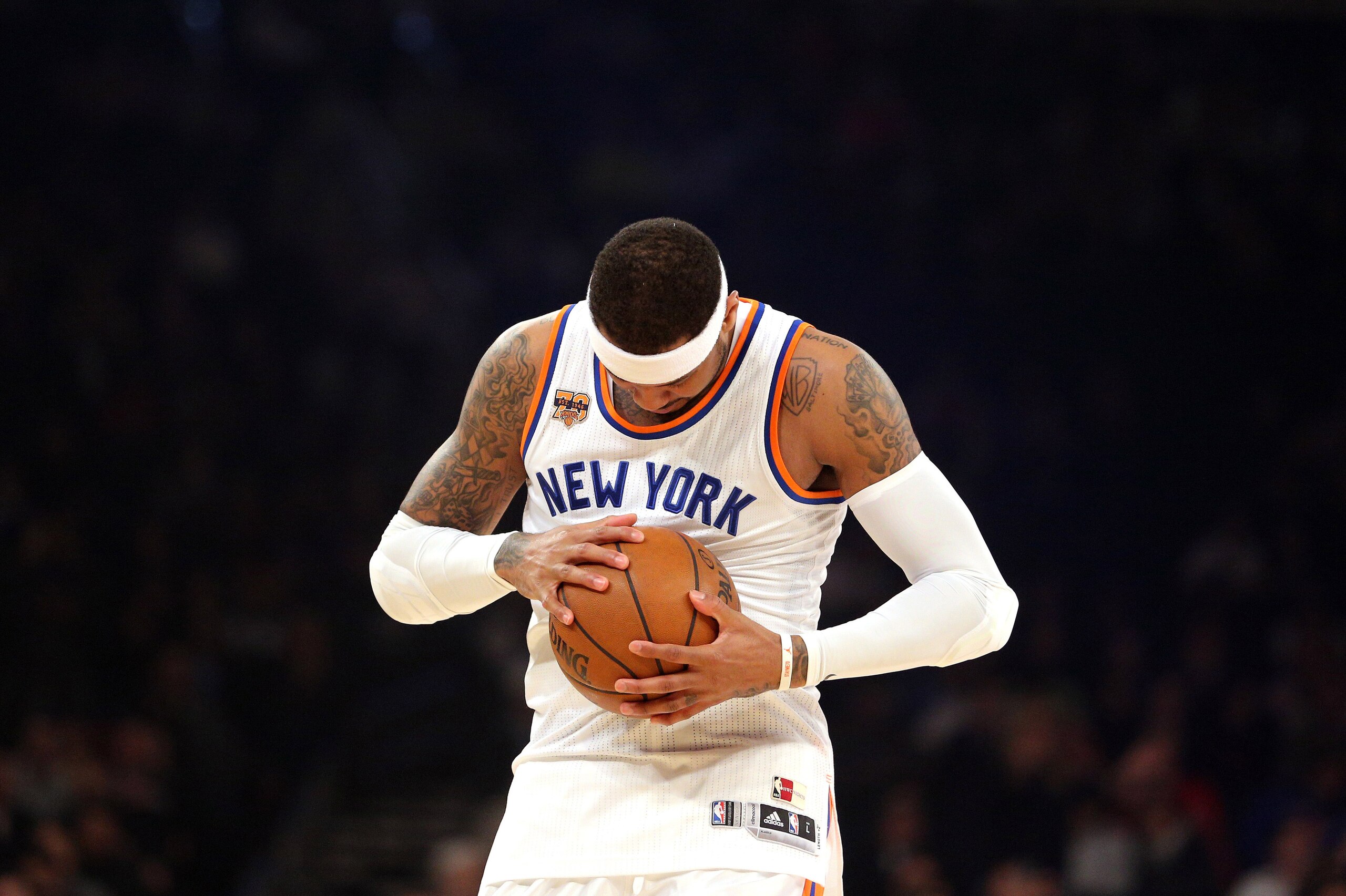 Mar 29, 2017; New York, NY, USA; New York Knicks small forward Carmelo Anthony (7) inspects the ball before the first quarter against the Miami Heat at Madison Square Garden. Mandatory Credit: Brad Penner-USA TODAY Sports