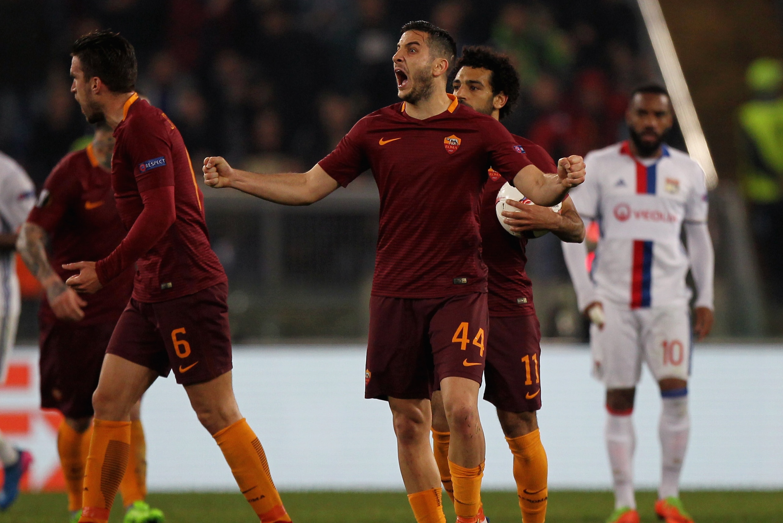 ROME, ITALY - MARCH 16: Kostas Manolas (L) with his teammates of AS Roma reacts after the own goal scored by Lucas Tousart of Olympique Lyonnais during the UEFA Europa League Round of 16 second leg match between AS Roma and Olympique Lyonnais at Stadio O ROME, ITALY - MARCH 16: Kostas Manolas (L) with his teammates of AS Roma reacts after the own goal scored by Lucas Tousart of Olympique Lyonnais during the UEFA Europa League Round of 16 second leg match between AS Roma and Olympique Lyonnais at Stadio O