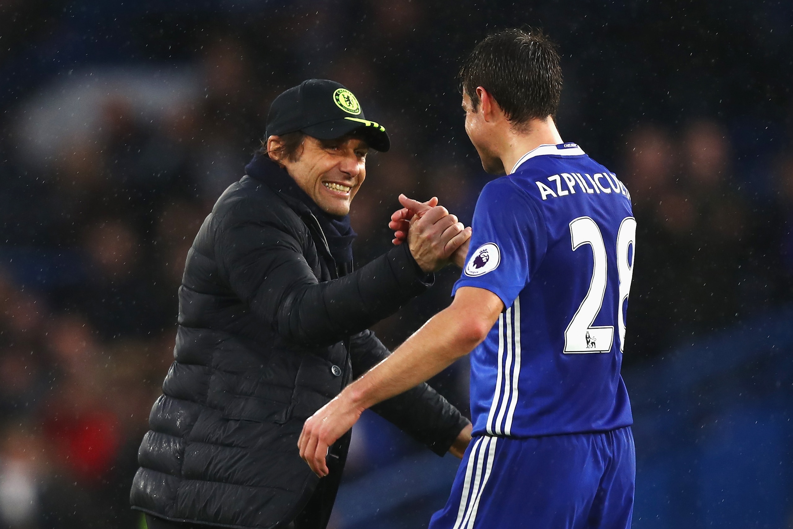 LONDON, ENGLAND - FEBRUARY 25: Antonio Conte, Manager of Chelsea (L) and Cesar Azpilicueta of Chelsea (R) embrace after the Premier League match between Chelsea and Swansea City at Stamford Bridge on February 25, 2017 in London, England.  (Photo by Clive 