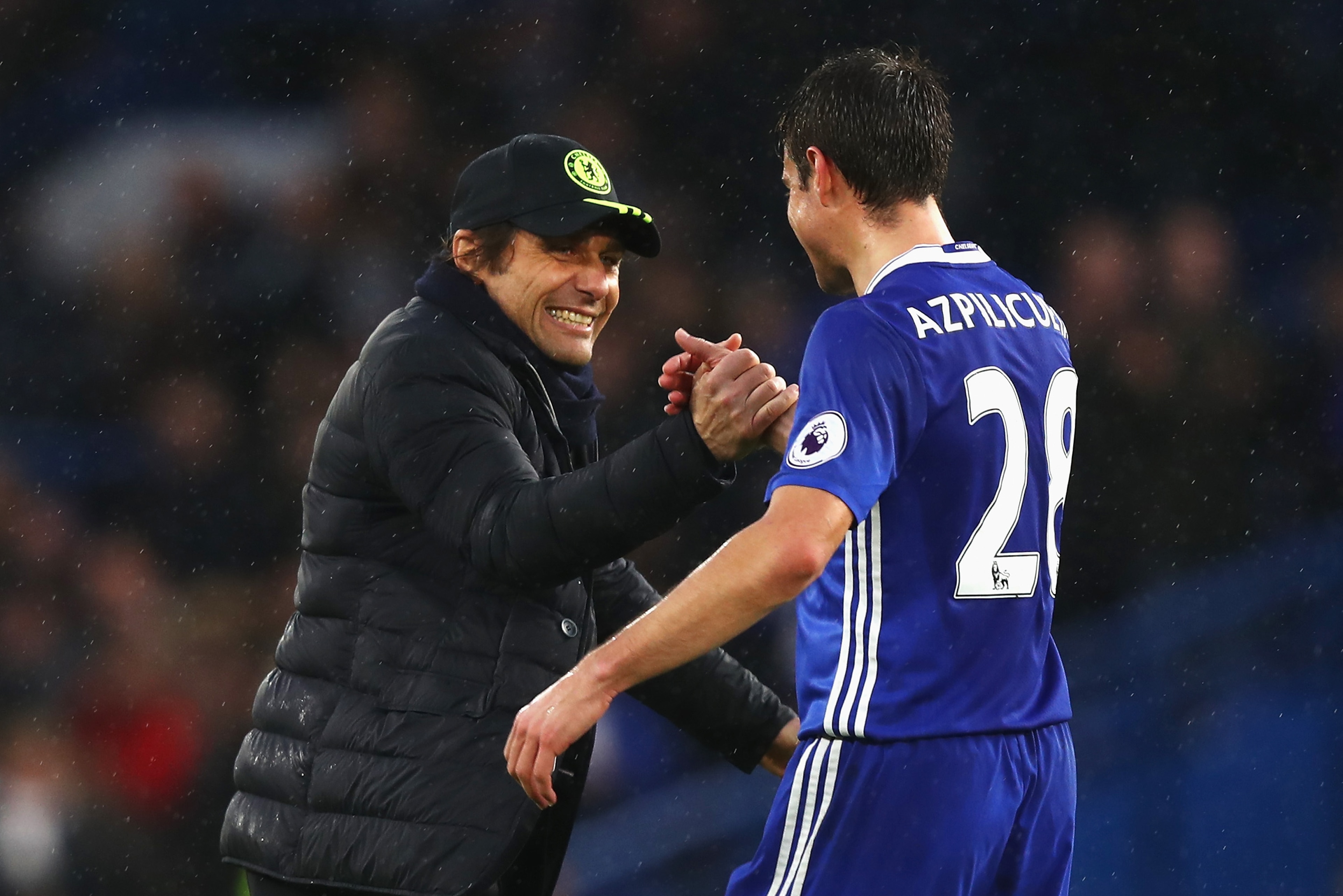 LONDON, ENGLAND - FEBRUARY 25: Antonio Conte, Manager of Chelsea (L) and Cesar Azpilicueta of Chelsea (R) embrace after the Premier League match between Chelsea and Swansea City at Stamford Bridge on February 25, 2017 in London, England.  (Photo by Clive 