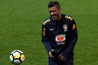 Brazil's player Paulinho laughs during a raining session with teammates in Melbourne on June 8, 2017, ahead of their football match against Brazil on June 9. / AFP PHOTO / SAEED KHAN / -- IMAGE RESTRICTED TO EDITORIAL USE - STRICTLY NO COMMERCIAL USE --  