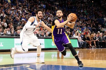 MINNEAPOLIS, MN -  MARCH 30: Tyler Ennis #11 of the Los Angeles Lakers drives to the basket against the Minnesota Timberwolves on March 30, 2017 at Target Center in Minneapolis, Minnesota. NOTE TO USER: User expressly acknowledges and agrees that, by down