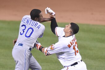 BALTIMORE, MD - JUNE 07:  Yordano Ventura #30 of the Kansas City Royals and Manny Machado #13 of the Baltimore Orioles fight during a baseball game at Oriole Park at Camden Yards on June 7, 2016 in Baltimore, Maryland.  The Orioles won 9-1.  (Photo by Mit