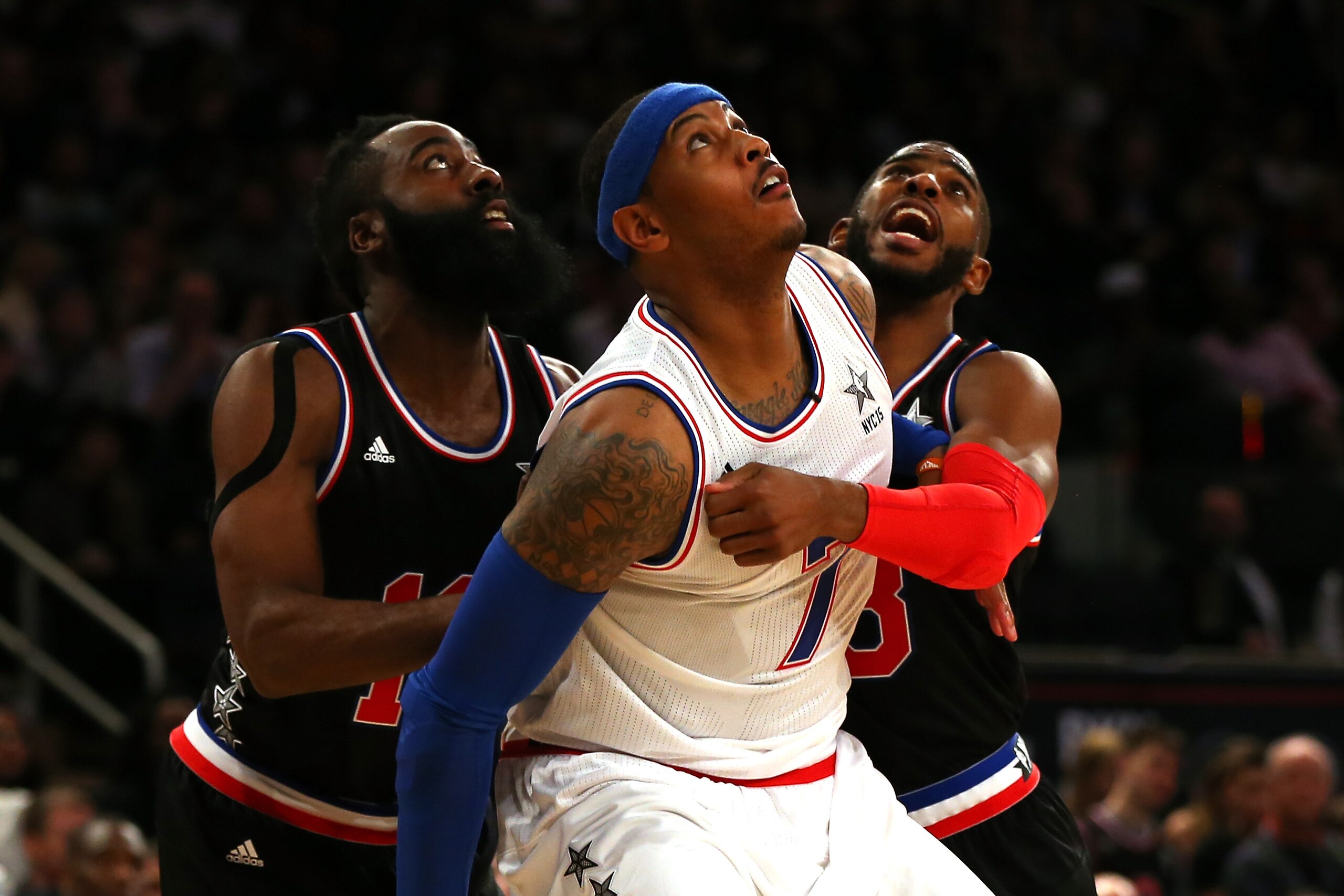 NEW YORK, NY - FEBRUARY 15:  Carmelo Anthony #7 of the New York Knicks and the Eastern Conference looks on against James Harden #13 of the Houston Rockets and the Western Conference and Chris Paul #3 of the Los Angeles Clippers and the Western Conference 