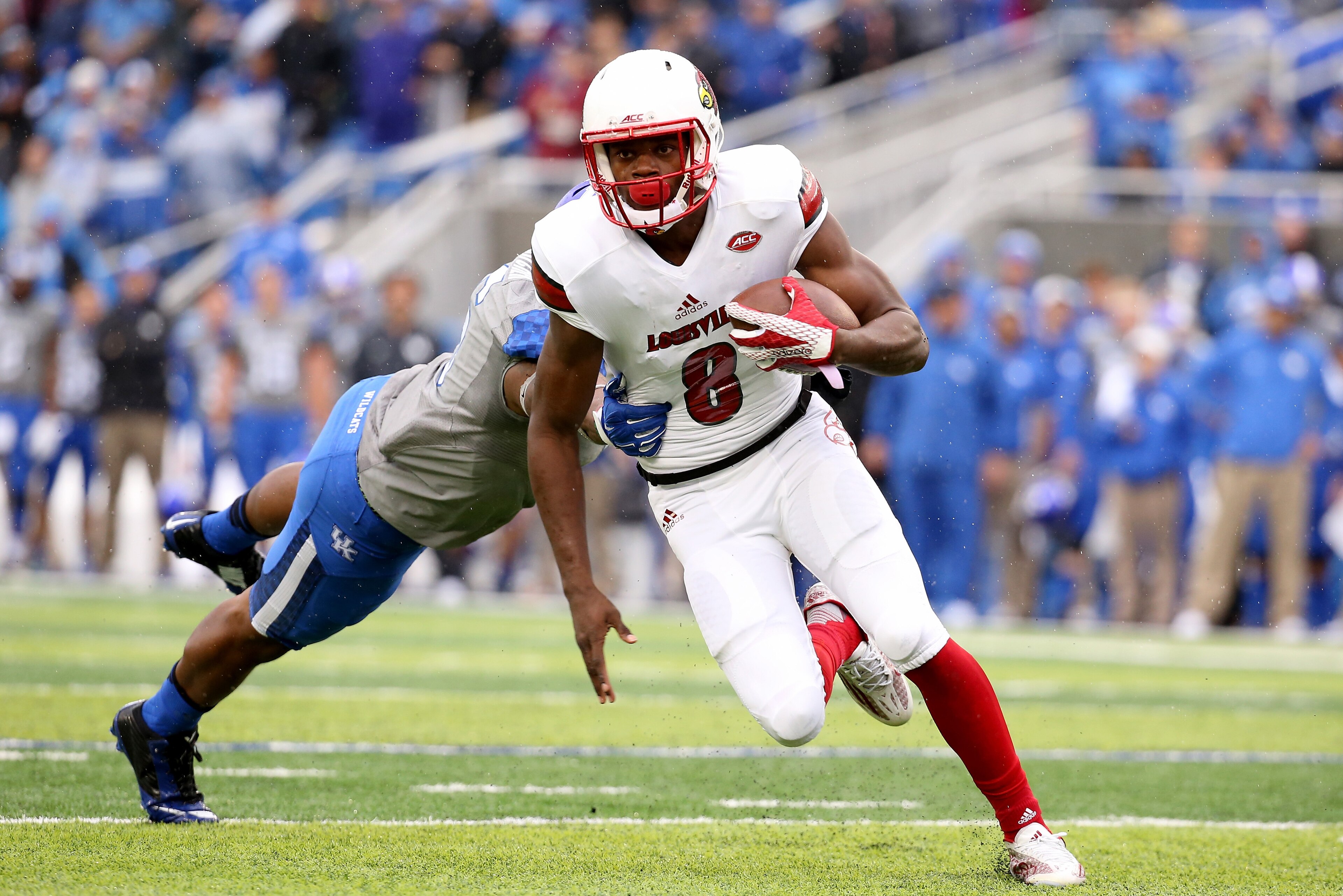 LEXINGTON, KY - NOVEMBER 28: Lamar Jackson #8 of the Louisville Cardinals runs for a touchdown during the game against the Kentucky Wildcats at Commonwealth Stadium on November 28, 2015 in Lexington, Kentucky. (Photo by Andy Lyons/Getty Images) LEXINGTON, KY - NOVEMBER 28: Lamar Jackson #8 of the Louisville Cardinals runs for a touchdown during the game against the Kentucky Wildcats at Commonwealth Stadium on November 28, 2015 in Lexington, Kentucky. (Photo by Andy Lyons/Getty Images)