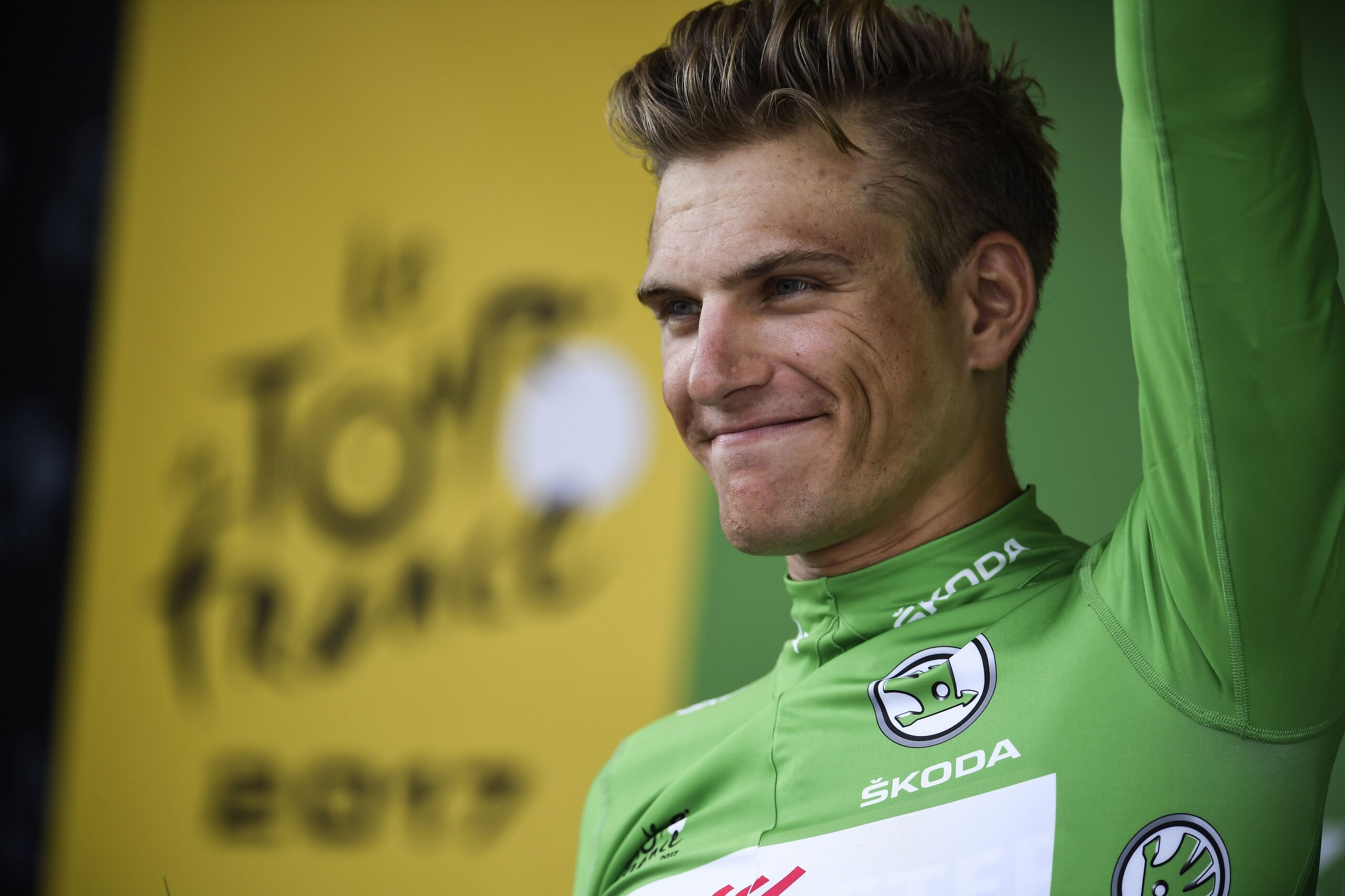 Germany's Marcel Kittel celebrates his green jersey of best sprinter on the podium at the end of the 178 km tenth stage of the 104th edition of the Tour de France cycling race on July 11, 2017 between Perigueux and Bergerac. / AFP PHOTO / Lionel BONAVENTU Germany's Marcel Kittel celebrates his green jersey of best sprinter on the podium at the end of the 178 km tenth stage of the 104th edition of the Tour de France cycling race on July 11, 2017 between Perigueux and Bergerac. / AFP PHOTO / Lionel BONAVENTU