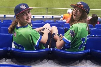 Gianna (left) and Grace DeVinney (right) have formed a friendship through the GTB. Grace's father, Josh, is the director of baseball of operations for the team.