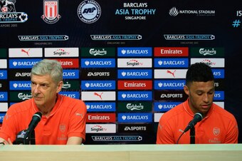 SINGAPORE - JULY 15:  Arsenal team manager, Arsene Wenger and Alex Oxlade-Chamberlain attends the Barclays Asia Trophy post match conference between Arsenal and Singapore Select XI at National Stadium on July 15, 2015 in Singapore.  (Photo by Suhaimi Abdu