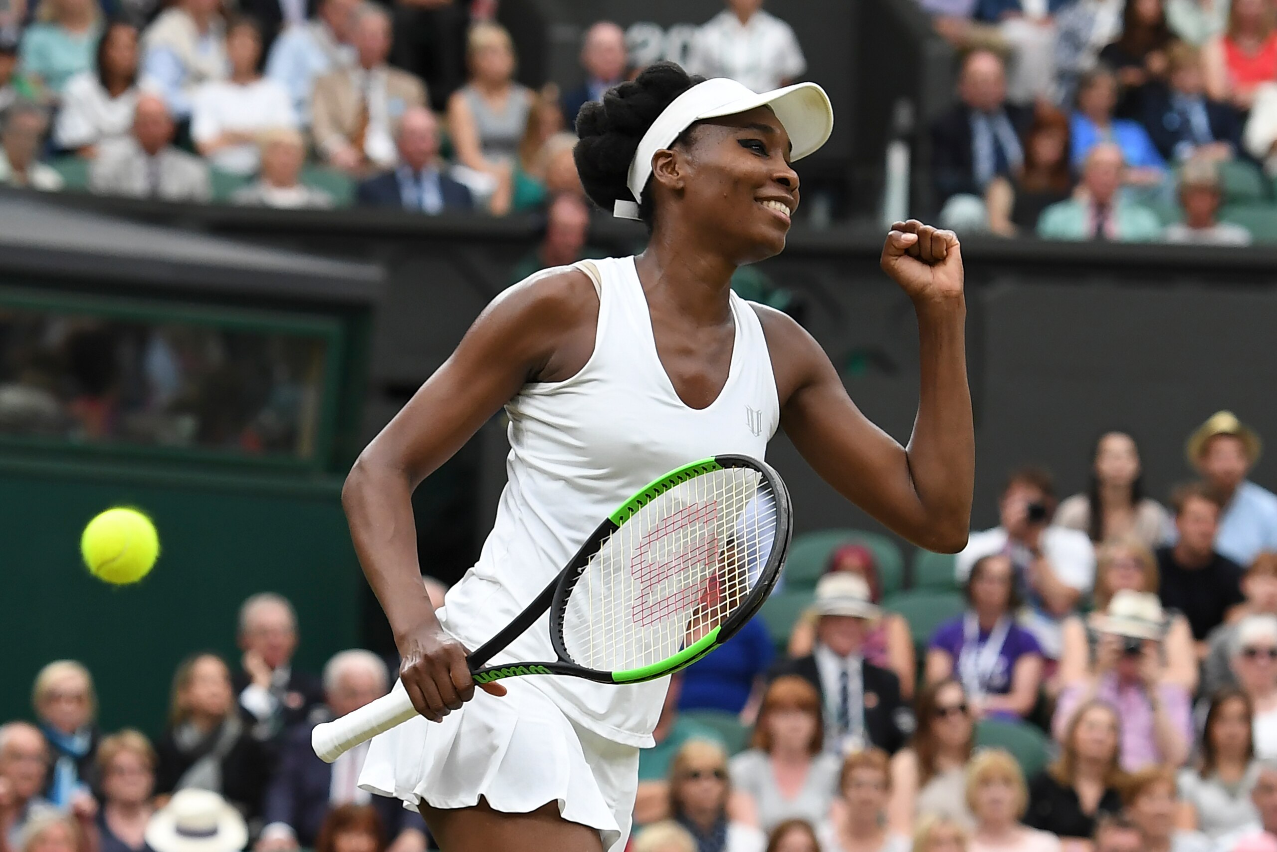 US player Venus Williams celebrates beating Latvia's Jelena Ostapenko during their women's singles quarter-final match on the eighth day of the 2017 Wimbledon Championships at The All England Lawn Tennis Club in Wimbledon, southwest London, on July 11, 20