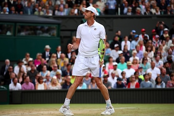 LONDON, ENGLAND - JULY 12:  Sam Querrey of The United States celebrates match point and victory during the Gentlemen's Singles quarter final match against Andy Murray of Great Britain on day nine of the Wimbledon Lawn Tennis Championships at the All Engla